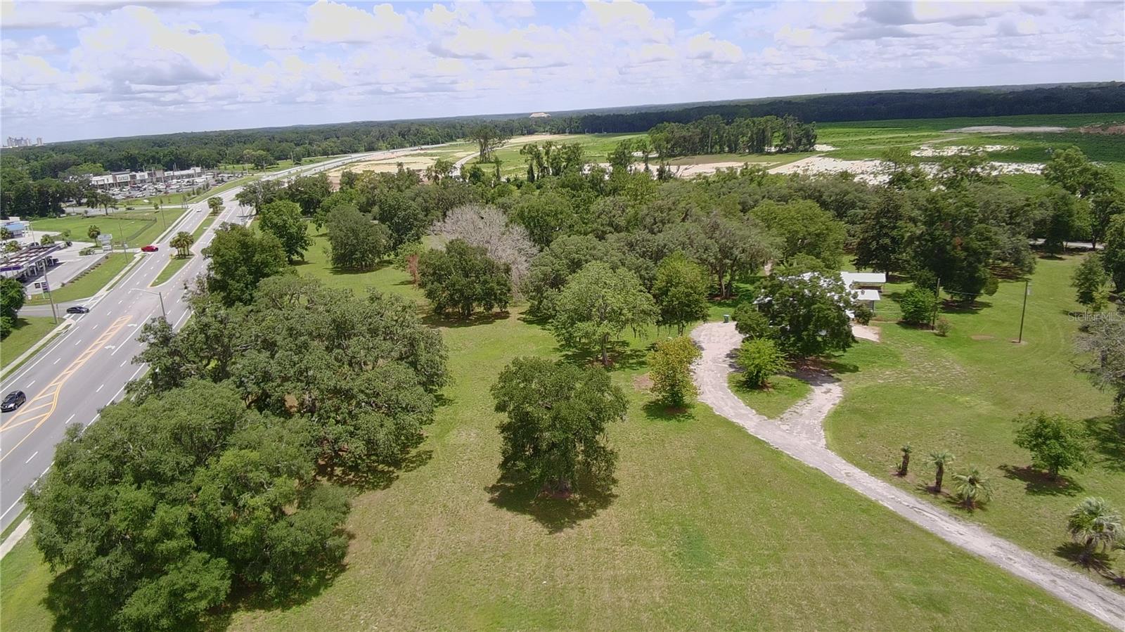 This prime 13 Acres (2 Parcels) located on Newberry Road with approximately 1200 sq ft of Road frontage.  Newberry is one of the fastest growing residential and commercial destinations.  This large contiguous parcel is located at the entrance of the City. This site is ideally suited for a master planned commercial development. Parcel located at intersection across of Newly built Publix and additional commercial Development under construction