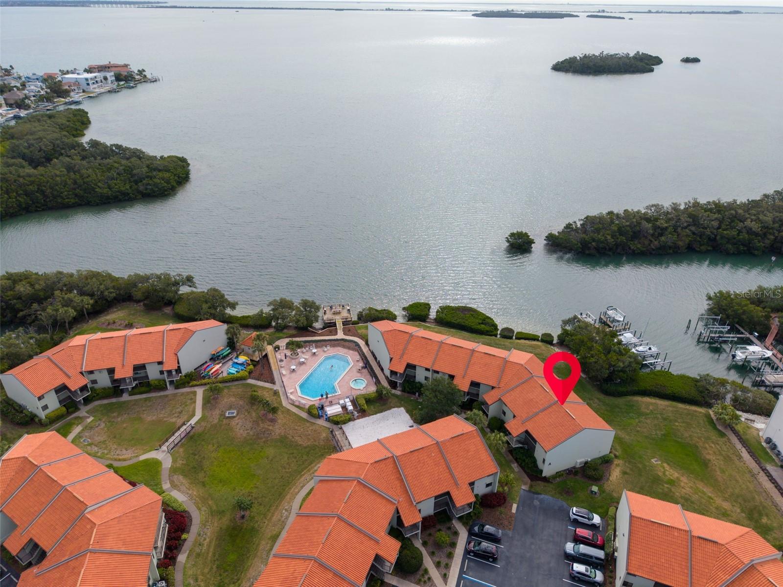 Welcome to a rare investment opportunity in Tierra Verde, Florida, where short-term rentals and transient use are permitted—something increasingly difficult to find in Pinellas County real estate. Located in the desirable Holiday Island / Wander Residences waterfront community, this top-floor, end-unit 2-bedroom, 2-bathroom condo offers flexibility for daily rentals (3-day minimum), personal vacation use, or full-time living. The current owner has operated the property successfully as a high-performing Airbnb, and rental records are available upon request.

If you’ve been searching for a condo near St. Pete Beach or Fort De Soto that allows short-term rentals, this is an exceptional opportunity to own a property that can generate income while still enjoying it yourself. Buy now, generate cash flow, vacation when you want, and continue operating a successful short-term rental in Tierra Verde.

This bright and welcoming condo features a well-designed layout with beautiful side water views from the living room, primary bedroom, and private balcony, creating the perfect setting for relaxing after a day at the beach. The unit is super clean, freshly painted, and move-in ready with tile and luxury vinyl flooring throughout. Both bathrooms have been nicely updated, and the eat-in kitchen with breakfast bar offers functionality with room for future customization. Furnishings are optional, making it easy to create a turnkey rental property or vacation retreat.

The Holiday Island / Wander Residences community offers a true resort-style waterfront lifestyle with amenities that are highly attractive to vacation renters and residents alike. Features include a heated pool and jacuzzi, tennis and pickleball courts, boat dock with slips available for rent, day dock, kayak storage, bike storage, BBQ deck, and clubhouse with fitness room, billiards, and laundry facilities. The community is also pet friendly, adding even more appeal for guests and owners.

Location is a major highlight. Tierra Verde is one of the most sought-after waterfront communities in the Tampa Bay area, just minutes from the pristine beaches of Fort De Soto Park, St. Pete Beach, and Pass-a-Grille. Residents and visitors enjoy easy access to marinas, waterfront dining, and local favorites such as Billy’s Stone Crab and the Island Grille. The vibrant culture of Downtown St. Petersburg—known for its museums, nightlife, restaurants, and waterfront parks—is only about a 15-minute drive away.

Whether you are searching for a Tierra Verde investment property, a waterfront condo with strong rental income potential, or a Florida Gulf Coast vacation home, this property offers flexibility, location, and proven income performance.

Opportunities like this—a fairly priced waterfront condo in Pinellas County that allows short-term rentals and transient use—are extremely rare. Don’t miss the chance to own your own piece of paradise in Tierra Verde.