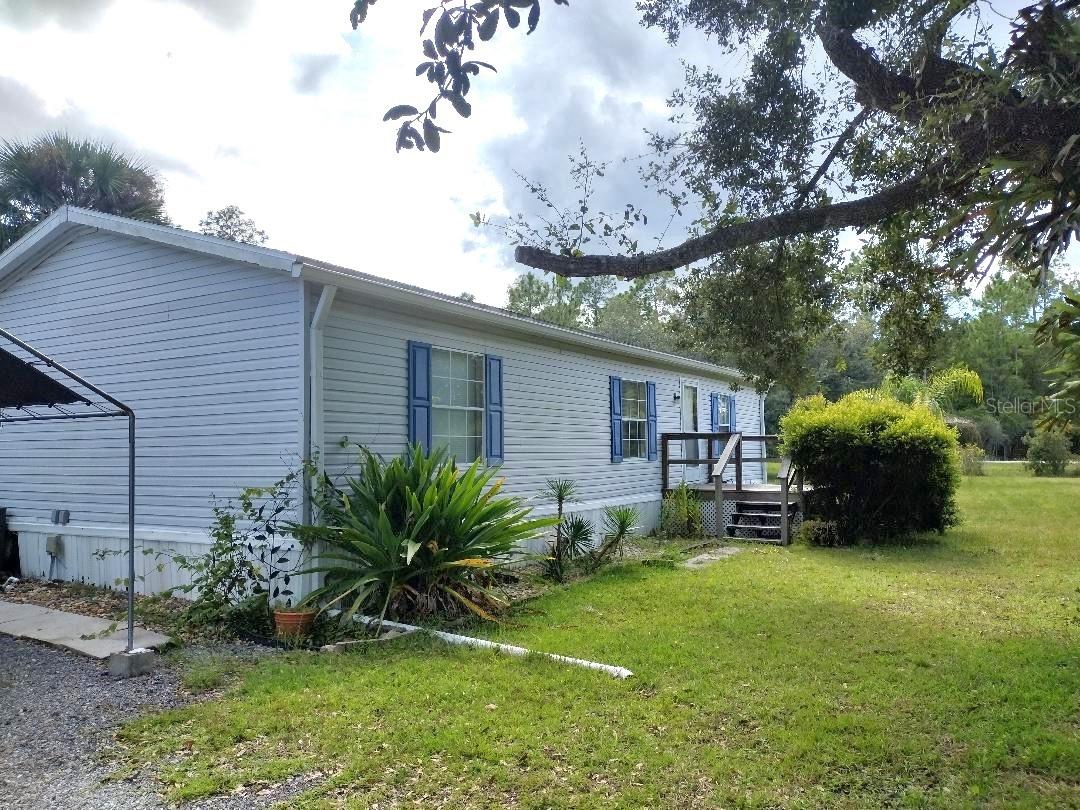 Escape to the country with this 1997 manufactured home offering 3 bedrooms, 2 baths, and a spacious split floor plan on 2 beautiful acres. Enjoy the outdoors on your inviting front deck, a private stocked pond, perfect for fishing and relaxation.  Inside, the home features a dining room and a spacious kitchen with plenty of storage and counter space. The large master bedroom includes a master bath with double sink vanity, garden tub, and separate shower—a true retreat. Two additional bedrooms and a full bath provide comfort for family or guests.  The property is nicely landscaped and partly fenced, with storage sheds for tools, hobbies, or equipment. With room for farm animals, plus space to park work trucks, boats, or an RV, this home is ideal for country living with modern convenience.  Located just minutes from freshwater fishing and within 30 minutes to shopping, medical facilities, the hospital, and I-95, you’ll love the balance of privacy and accessibility.
Roof 10 years old.