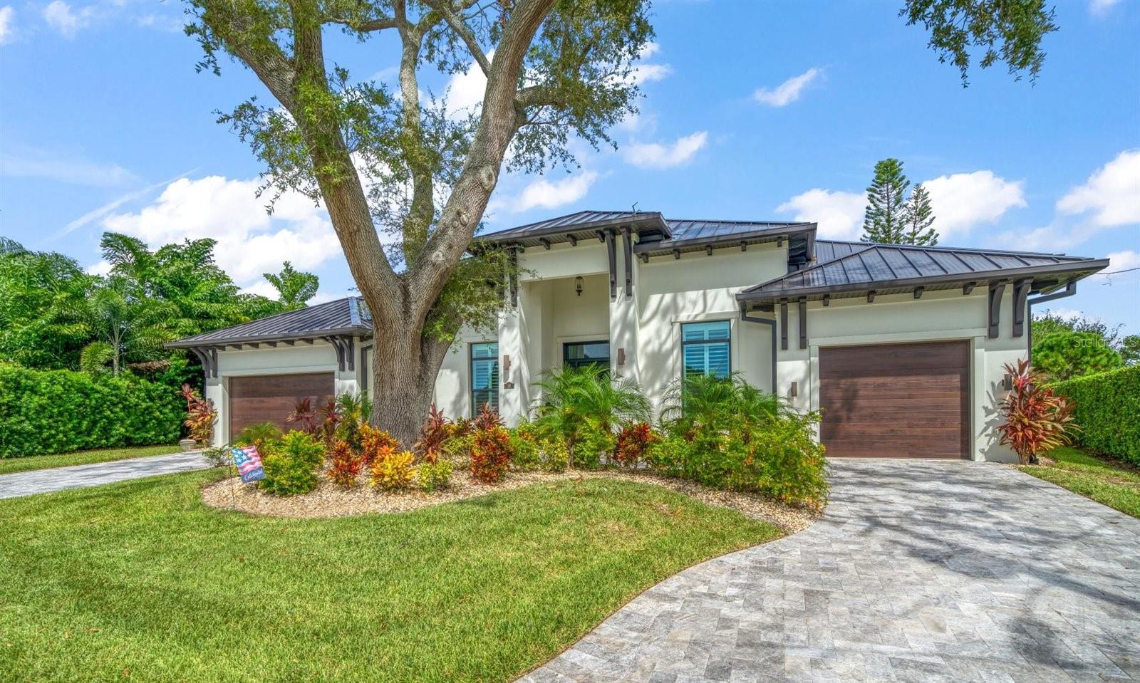 LOCATION, LOCATION, LOCATION!!!  This masterfully built executive residence sits on the 8th fairway of the private Pelican Golf Course and  delivers clean, sophisticated lines and the highest level of interior finishes. Thoughtfully designed to accommodate today's lifestyle, the home offers family friendly open living space and a split bedroom floor plan. Perfect for entertaining, the great room setting creates a large central gathering point for the home and is richly appointed with beautiful hickory flooring and 14 foot high coffered ceilings. The great room flawlessly transitions to the chef's kitchen complete with Subzero refrigerator and freezer, Wolf 6 burner gas range, dual Bosch dishwashers, Wolf microwave drawer, Subzero ice maker and a Subzero 180 bottle wine cooler.  With distinctive custom cabinetry and rich quartzite counters, the center island kitchen was designed to both entertain and create. The master bedroom suite features his and her walk-in closets, a spa inspired bathroom with a large soaking tub, an oversized shower and dual vanities with a cosmetics station. Step through hurricane impact doors to the backyard and enjoy your private saltwater pool with sun deck and calming views of the Pelican's 4th and 8th fairways. The outdoor patio also features a gas burning fireplace and to fully enjoy your outdoor living area, you will appreciate the motorized retractable screens. Other amenities include a two car garage and separate air-conditioned one car garage that measures approximately 300 square feet and is wired for a golf simulator.  Durable energy efficient construction complete with a Generator and hurricane impact windows and doors offers piece of mind while the superior finishes make this home a must-see if you are looking to purchase a home in Belleair!