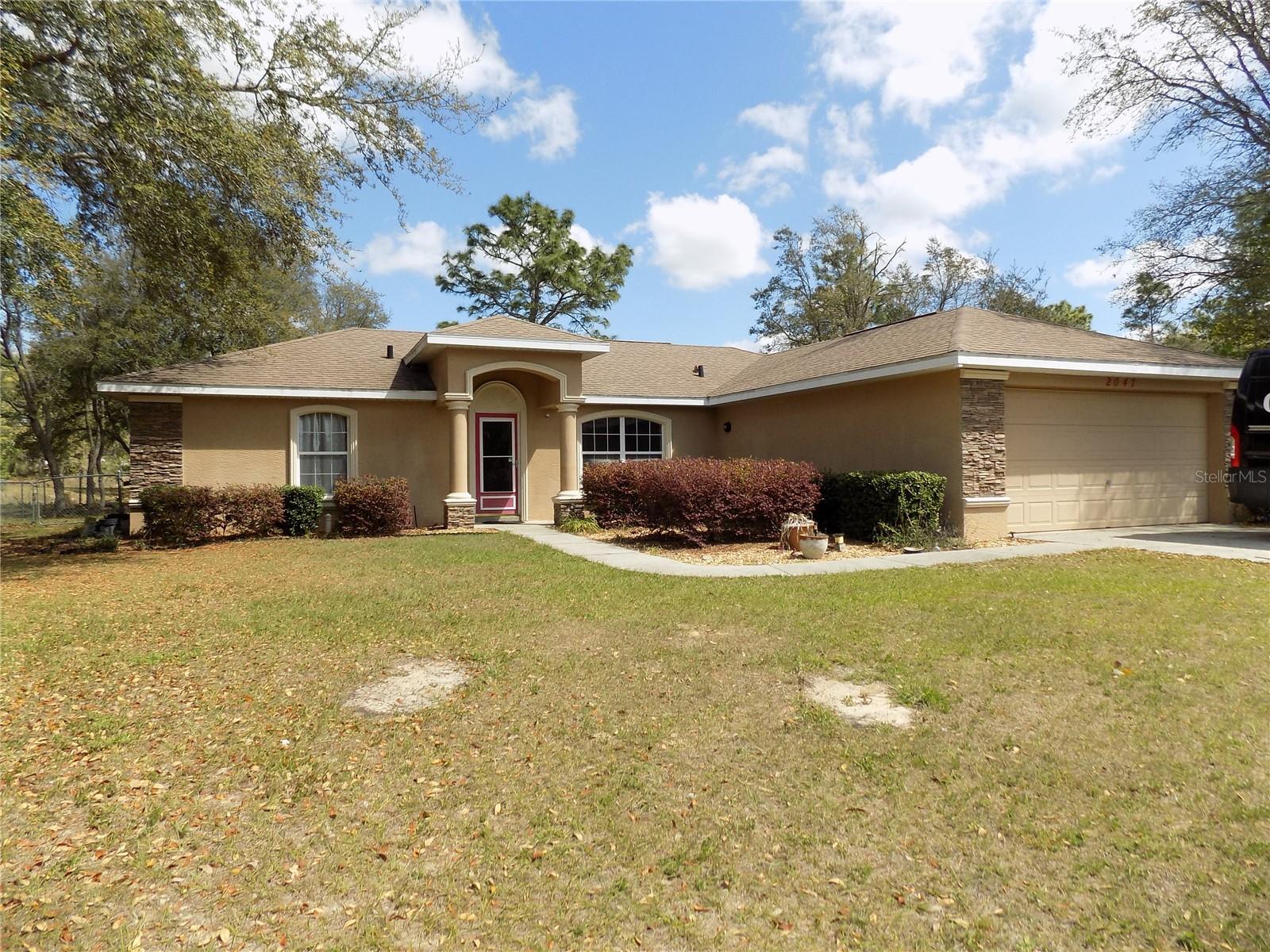 This wonderful 3 bed / 2 bath POOL home with NO HOA welcomes you to Citrus Springs development which gives you a feeling of country living. This 2006 built home is located on a LOT where you will not have any immediate neighbors to the back or directly across the street. Upgrades include new kitchen appliances, new ceramic tile flooring in all bedrooms, new 4-ton a/c unit with a separate auxiliary unit for the garage. Extra insulation on garage door. Also, there is a propane tank for the kitchen range and water heater. New large stackable washer & dryer. PAVERS used for pool deck and both the covered lanai & open patio area. The large 24'x12' shed has electric and roll up door for easy access. The owners did a good job with the upgrades. Come have a look, I think you will like what you see.