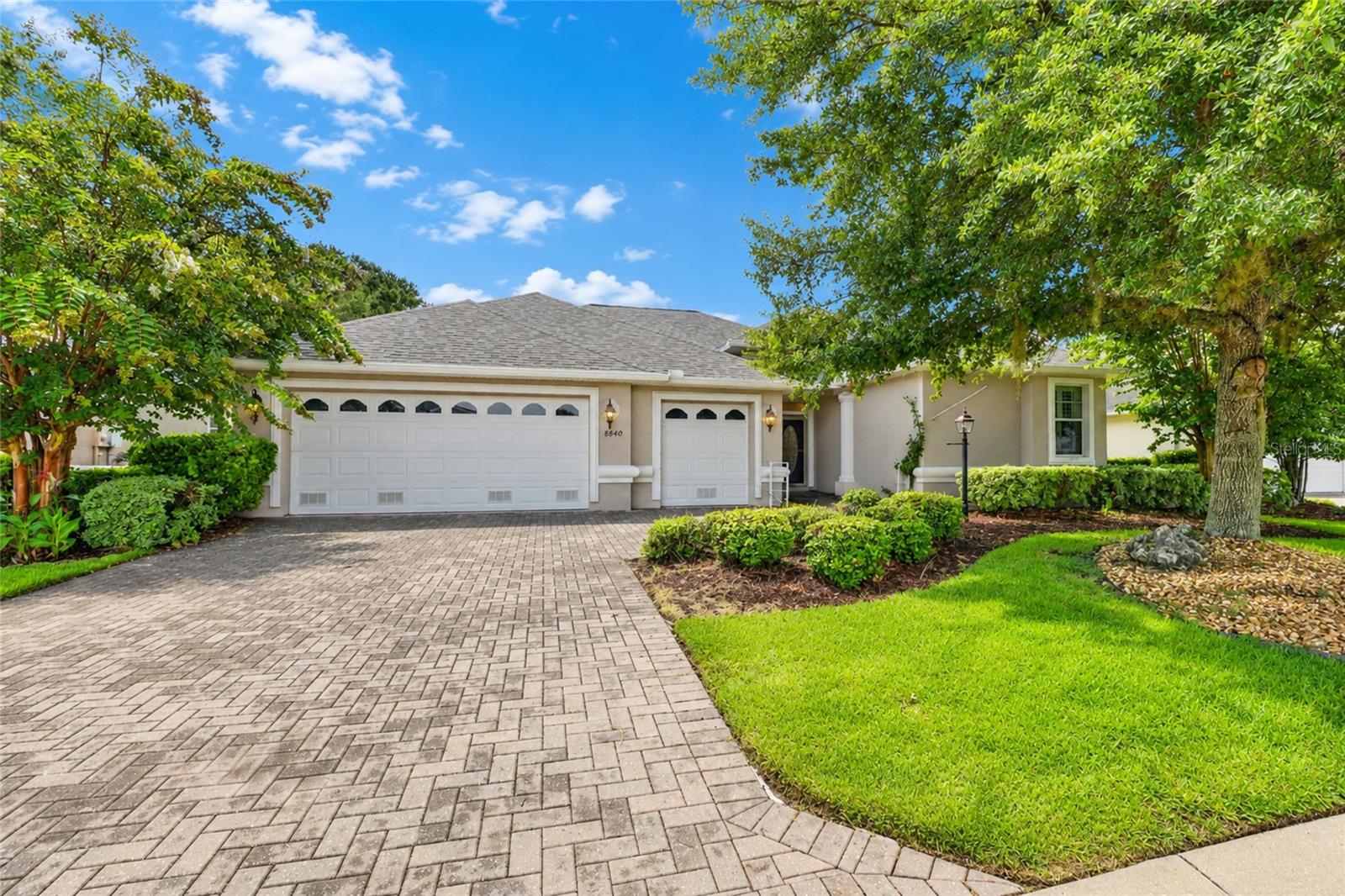 Custom Sterling II in the estate section of Candler Hills at On Top of the World offering approximately 2,275 living square feet on an oversized golf course lot overlooking the 11th hole of Candler Hills Golf Course with golf course and sunset views.

Renovated in 2023, this open-concept home features luxury vinyl plank flooring throughout, crown molding, tray ceilings, louvered interior shutters, recessed lighting, updated fixtures, and 5¼-inch baseboards. The kitchen was remodeled in 2023 with updated countertops, cooktop, built-in oven and microwave, range hood, and dishwasher.

The primary living areas flow seamlessly to the expanded lanai, completed in 2023 with new flooring and an extended birdcage, providing additional outdoor living space overlooking the golf course.

Additional updates include a new roof with transferable Platinum Protection Warranty (2026), HVAC (2020), and washing machine (2026).

The oversized two-car garage includes a separate golf cart garage with its own overhead door, providing space for a golf cart, storage, or workshop.

Located in Candler Hills at On Top of the World, residents enjoy access to community amenities, including golf, recreation centers, fitness facilities, clubs, walking trails, and additional amenities. Schedule your private showing today.
