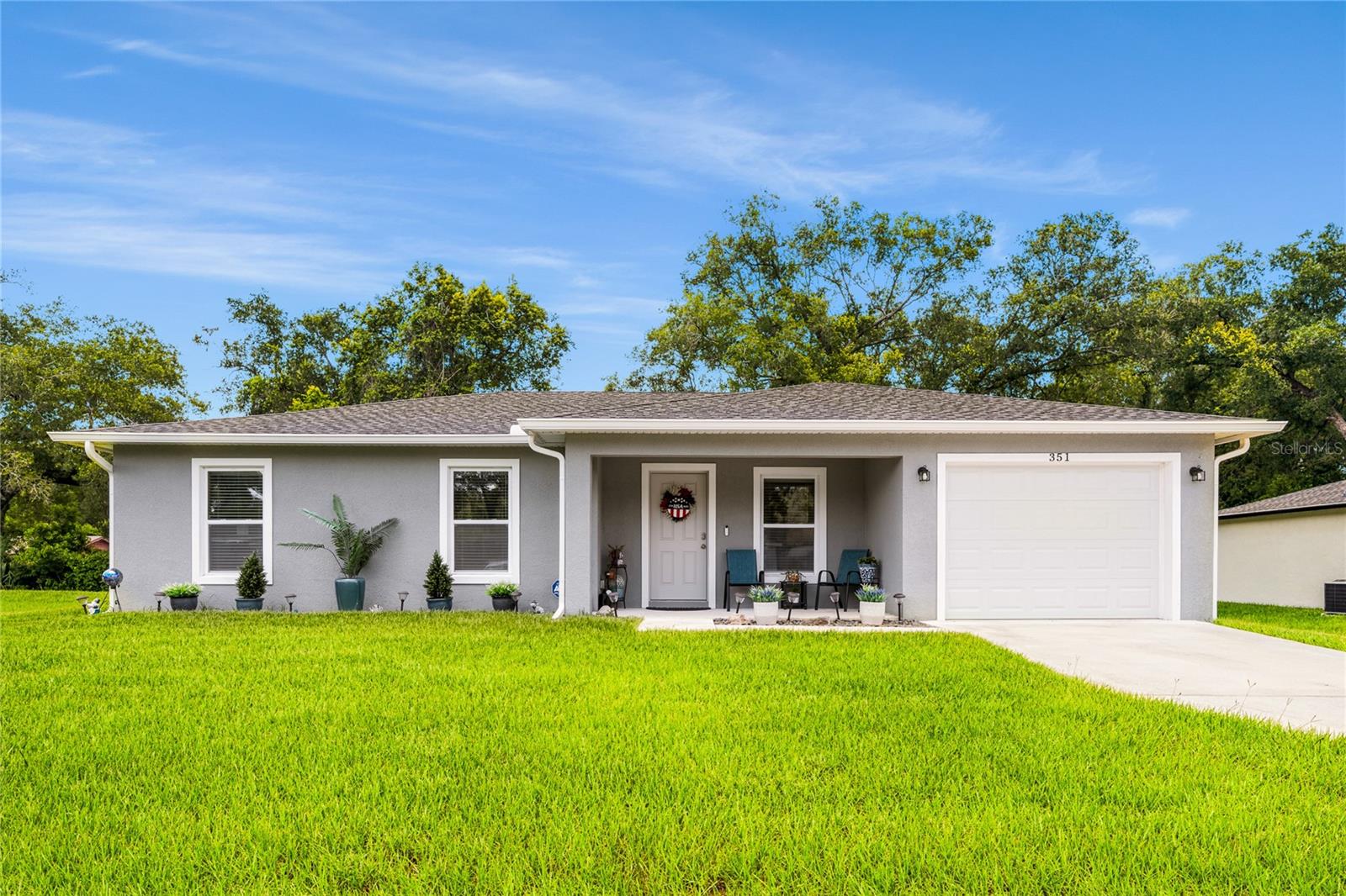 Built in 2023 and beautifully maintained, this move-in ready 3-bedroom, 2-bath home offers
modern style, quality finishes, and a peaceful setting.
With 1,197 heated square feet, this thoughtfully designed open floor plan features  vaulted
ceilings, luxury vinyl plank flooring throughout, and abundant natural light. The spacious kitchen is
the heart of the home, showcasing white shaker cabinetry, stainless steel appliances, generous
counter space, and a large center island with bar seating that opens seamlessly to the living and
dining areas.
The split-bedroom floor plan provides privacy for the primary suite, while two additional bedrooms
offer flexibility for family, guests, or a home office.
Step outside to a covered patio overlooking the backyard with a beautiful wooded backdrop
creating a private setting to relax or entertain.
Additional highlights include an interior laundry room with cabinetry and folding space, an attached
garage, neutral finishes throughout, and exceptional curb appeal. Conveniently located near
shopping, dining, schools, parks, and major highways, this nearly new home offers the perfect
combination of comfort, convenience, and value.
Why wait to build when you can move right into this beautifully maintained 2023 home?