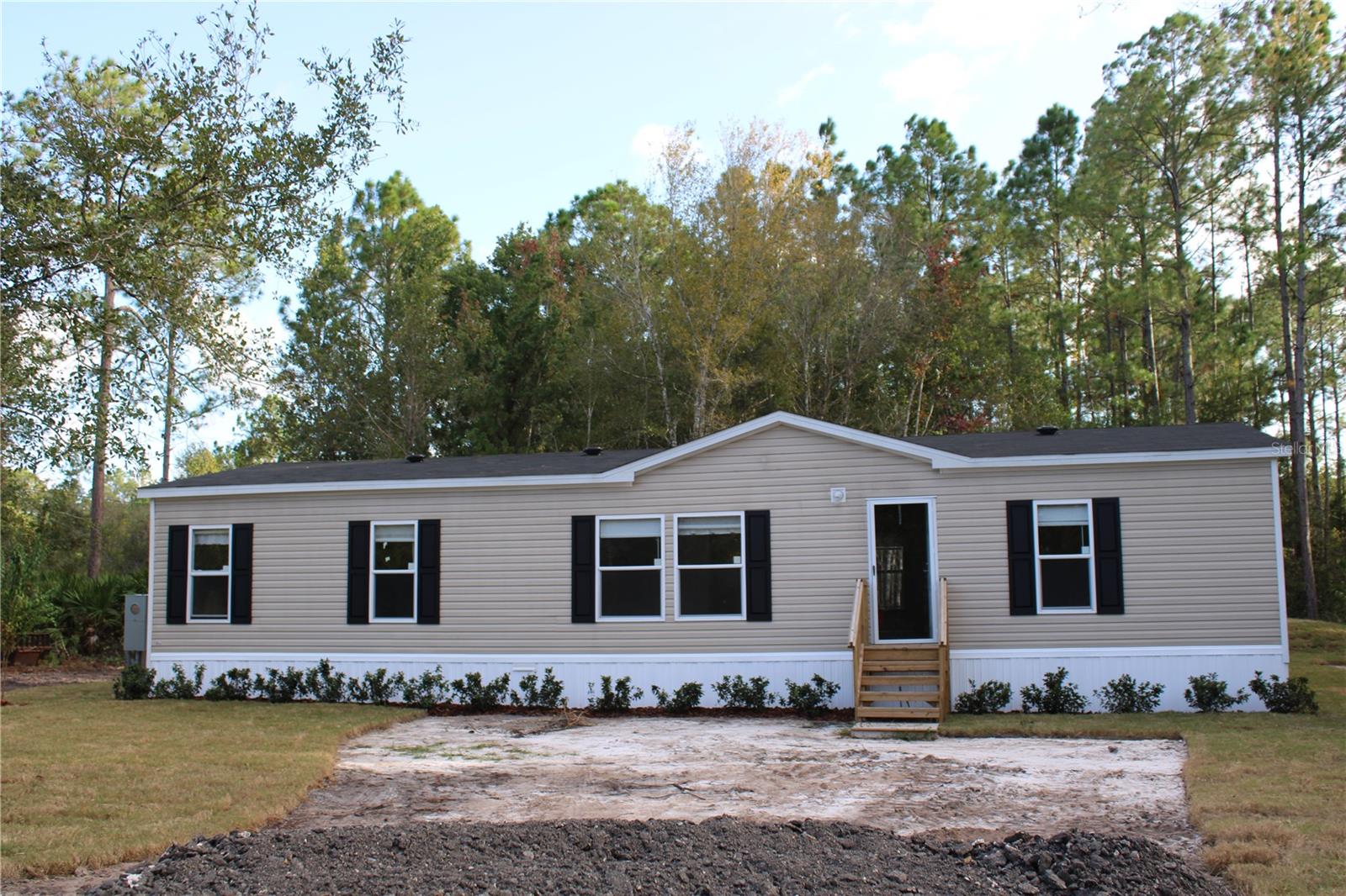 If quiet country living is what you desire look no more, this charming 3 bedroom, 2 bath, home is nestled in the woods and provides plenty of privacy and peaceful living. No HOA's or Zoning restrictions. Plenty of room for your toys, bring your RV, Boat, ATV, and pets. This property is located near Bull Creek Fish Camp which offers a public boat ramp and banks for fishing, also nearby are 2 community parks, country store, hardware and feed store. 20-30 minutes From Flagler Beach, Palm Coast, Shopping, Schools, and Hospital.