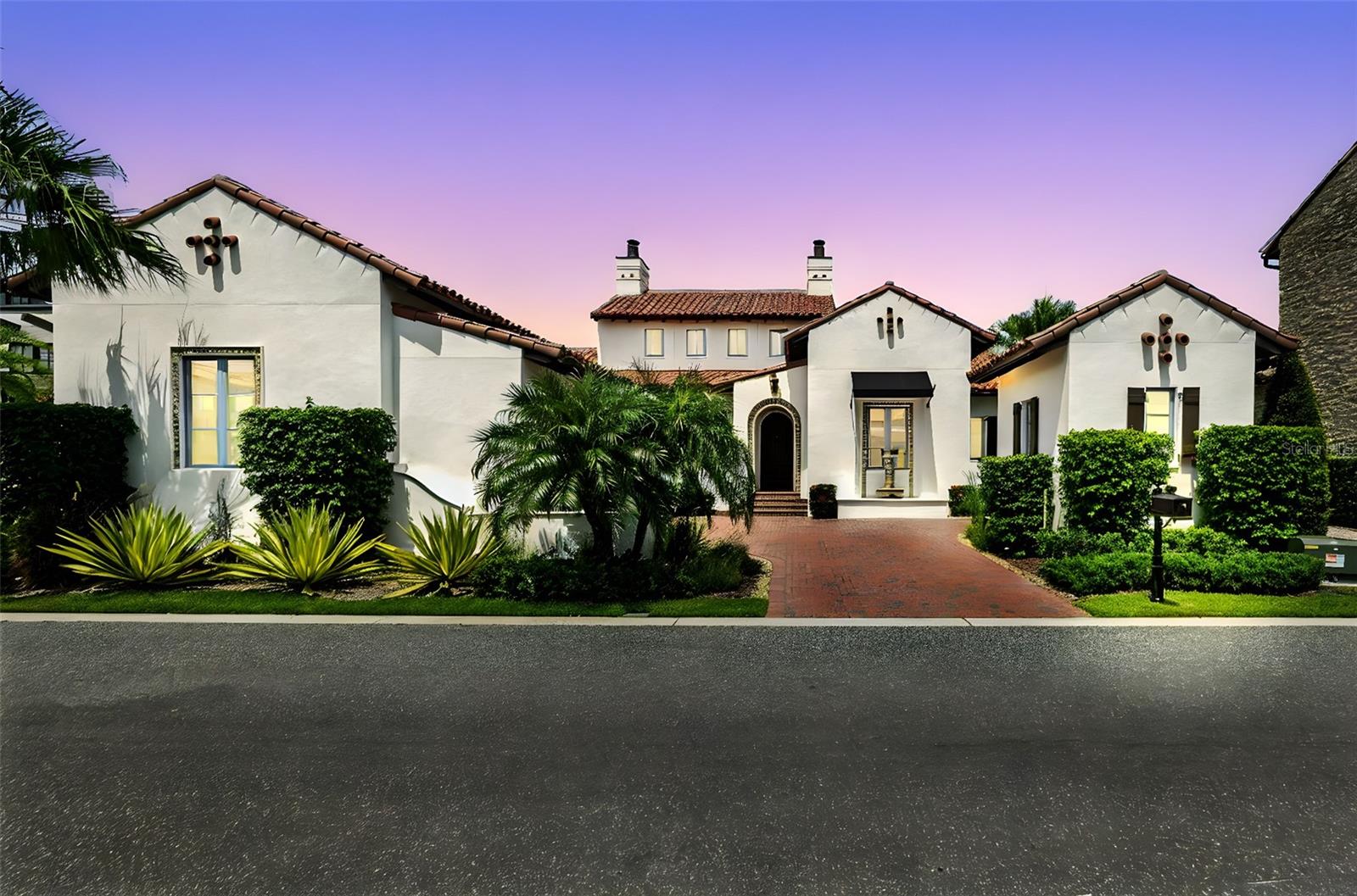 Beautiful and elegant Spanish-inspired retreat in Golden Oak at Walt Disney World® Resort - First time listed since new. Discover the perfect harmony of timeless elegance and relaxed sophistication in this beautifully crafted one-level Spanish-style cottage built by Issa Homes in 2020. Presented in as-new and move-in-ready condition with full-time use only since 2023. The Sonatina custom mediterranean floorplan offers four beds, four and a half baths, nestled within the exclusive enclave of The Cottages near Lullaby Park - one of the most desirable and newest neighborhoods of Golden Oak. Enjoy morning walks past an exclusive collection of incredible homes with timeless architecture, refined living, and a welcoming sense of community. Designed for both intimate living and grand entertaining, the home welcomes you with an impressive entry, imported European floor tiles, wood plank floors, a genuine clay-tiled roof, and a calm, neutral color palette, complemented by sophisticated Professional Interior design. An open-concept layout flows effortlessly to the expansive outdoor veranda with remote screen, where a summer kitchen overlooks your heated pool and spa with a fountain, creating a seamless indoor-outdoor lifestyle. Impressive primary bedroom with a vaulted beamed ceiling, spacious luxury ensuite bathroom with tub and shower, and a fully fitted walk-In closet. Chef’s dream kitchen is ideal for entertaining, featuring a hand-hammered copper sink, Sub-Zero and Wolf Appliances, wine cooler, high-end wood cabinetry with self-closing doors and drawers, and antique-style light fixtures. Custom interior designer upgrades Include: 'Made Goods’ lighting fixtures, Phillip Jeffries grasscloth and linen wall coverings, Samsung Art Frame TVs in all four bedrooms, large Samsung outdoor flat screen in exterior covered patio, tall privacy landscaping and palm trees with new exterior lighting in the back yard added in 2022. Fresh interior paint 2025, wired security cameras, new fountain fixtures, and more! Residents enjoy convenient access to the Summerhouse, the private Golden Oak Clubhouse, offering casual, elegant dining, beautifully landscaped courtyards, a resort-style pool, a state-of-the-art 24/7 fitness center, and an inviting family lounge. Enjoy riding your electric golf Cart from your standalone cart garage, taking shortcuts to Disney’s Summerhouse and Four Seasons amenities just moments away. A two-car garage to the front of the property provides easy access to the inside of the home. As part of Club Life: your special connection to the magic, homeowners enjoy personalized concierge-style services offered by the Golden Oak Member Services team. Enjoy private park transportation, exclusive club events, unforgettable theme park experiences, and so much more—all with the touch of Disney magic. Also within the community is the renowned Four Seasons Resort Orlando at Walt Disney World®, featuring the 18-hole Tranquilo Golf Course, a luxurious full-service spa, award-winning restaurants, and world-class amenities. Schedule your private tour today! View 360 Tour at https://www.zillow.com/view-imx/0b6a2c04-07b4-4ca4-9fda-2749d27ddf9e?setAttribution=mls&wl=true&initialViewType=pano&utm_source=dashboard