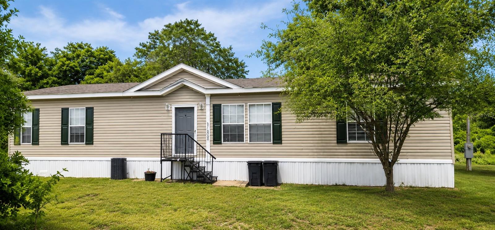 COUNTRY-STYLE HOME ON 15+ ACRES BETWEEN OCALA AND LAKE COUNTY.

Properties like this are becoming increasingly difficult to find. Surrounded by towering pines, native oaks, and the natural beauty of Old Florida, this private HOMESITE offers room to roam, space to breathe, and a hidden connection to the water waiting to be discovered beyond the trees.

Inside, the OPEN CONCEPT design creates a natural flow between the COUNTRY KITCHEN, dining area, and living room. A stunning STONE FIREPLACE anchors the main gathering space, creating a warm focal point for family gatherings, holiday celebrations, or simply relaxing at the end of the day. Natural light and views of the surrounding landscape help bring the outdoors in.

The dedicated office with French doors makes WORK FROM HOME feel a little different here. When the workday is done, your acreage is waiting just outside.

EXPLORE YOUR PROPERTY STARTING JUST A FEW STEPS OUT OF THE BACK DOOR. Pick a few wild blackberries along the way as you wander beneath towering pines and native Florida woods. The farther you explore, the more this property reveals, eventually leading to its connection with LAKE PENDARVIS.

Room to roam. Breathe fresh air. Live life your way.