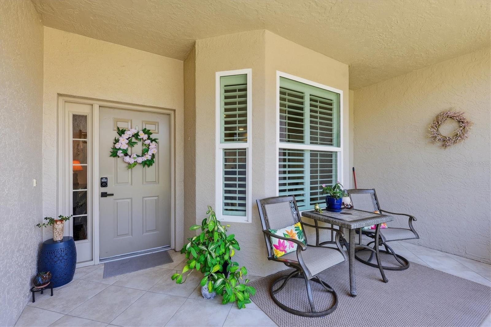 Impressive 1ST floor ABBEY model, in sought after Stoneybrook Golf & Country Club in Palmer Ranch!  Entire condo has been updated to today's designer tastes.  And to make it even more desirable...all the windows and glass doors are HURRICANE IMPACT for extra peace of mind and energy efficiency. There are views from every window as this is an END unit, so you can see all of the #4 tee boxes from different windows of the home and amazing, and expansive views from the the back lanai of the 4th hole and lake, where nature abounds with birds, and wildlife. The impact glass secures peace and quiet inside, and brings in loads of natural light. Windows are adorned with classic plantation shutters and shades. The updated kitchen is stunning, showcasing all granite counters, tiled back splash, soft close drawers, SS appliances and an eat-on bar for entertaining guests or sit at the casual dinette overlooking yet another tiled and screened in lanai to relax and enjoy the fresh air all year round. Both bathrooms have been tastefully updated with walk-in, tiled glassed showers, and raised stone vanities. The thoughtful split-bedroom floor plan provides privacy for both owners and guests, while the DEN offers flexibility as a home office, reading room, or additional guest space, and enjoys a double door for more privacy. Additional highlights include a detached one-car garage with plenty of storage for your golf and beach gear.  Veranda Greens has its own heated pool and grill area just steps out your front door, this is the ease of first-floor living with no stairs! Stoneybrook Golf and Country Club just completed their new 18 hole golf course designed by Arthur Hills and Kipp Schulties and is said to be one of the best on the West Coast! Other top-notch amenities include Lighted Har-Tru tennis/pickle ball courts, pro-shop, well-equipped fitness center, bocce court, putting greens, driving range, fitness studio, sharing library, additional heated pool/spa, full service restaurant/bar, meeting rooms, catering facility, outdoor dining patio, walking/biking trails, fishing, planned activities like yoga, mahjong, line dancing, and so much more! Stoneybrook Golf and Country Club is a prime location close to the Legacy Trail, area Beaches, Costco, Lowes, restaurants and all Sarasota and Venice has to enjoy! Experience the perfect blend of comfort, style, and resort-style living—schedule your private showing today!