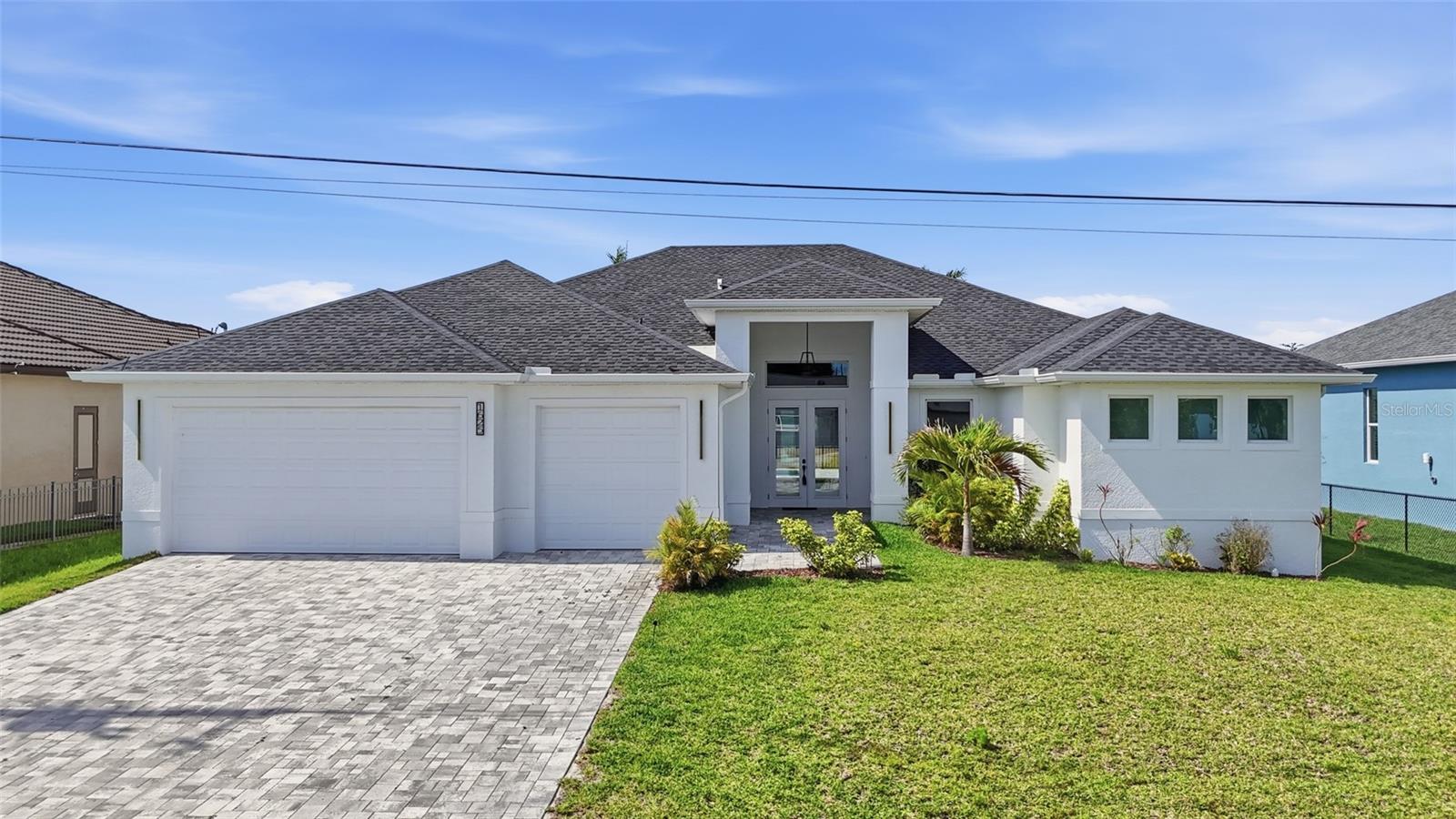 Welcome to your luxury waterfront retreat in the heart of Southwest Cape Coral. NEW CONSTRUCTION, brand new never lived in, this Gulf access pool home offers 3 bedrooms plus a den, 3 full bathrooms, and over 2,400 square feet of modern living designed for comfort, entertaining, and the Florida lifestyle. Situated on a GULF ACCESS canal, this property is perfect for boating enthusiasts looking to enjoy life on the water. Inside, you’ll find a bright open layout with soaring coffered ceilings, oversized impact windows and doors, and tile flooring throughout. The chef’s kitchen features a large island, walk-in pantry, custom cabinetry, stainless steel appliances, wine cooler, and an ideal flow into the main living and dining spaces. Pocketing sliders open seamlessly to the expansive covered lanai, creating true indoor outdoor living. The spacious primary suite offers lanai access, dual walk-in closets, a spa-inspired bathroom with a soaking tub, multiple shower heads, and dual vanities. Guests will appreciate the split-bedroom floorplan, offering privacy and comfort throughout the home. Step outside to your pool overlooking the canal, surrounded by a large paver lanai with plenty of space to relax or entertain. The concrete dock is ready for your boat, and the oversized 3-car garage provides room for vehicles, toys, and storage. This home has excellent AIRBNB potential as well! Located in one of Cape Coral’s most desirable waterfront neighborhoods, take your golf cart to Lobster Lady or 239 Prime Steakhouse! Minutes to Cape Harbour, waterfront dining, shopping, entertainment, parks, and some of Southwest Florida’s best boating destinations. Enjoy easy access to Fort Myers, Sanibel, and the Gulf beaches while still being minutes from everyday conveniences