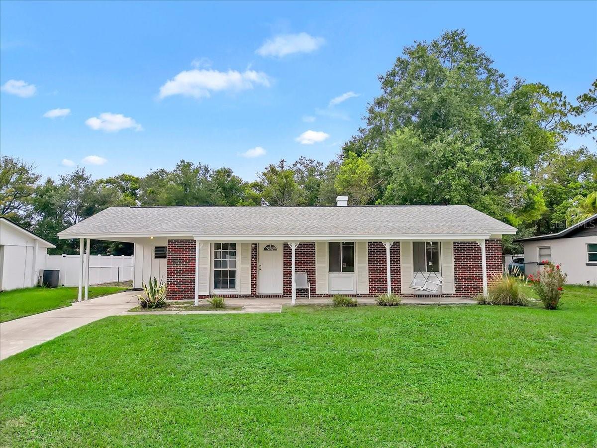 Welcome home to this beautifully updated, move-in ready 3-bedroom, 2-bath residence, solidly built and perfectly situated on a fully fenced 0.25-acre lot. This property offers both comfort and functionality, featuring a covered carport for parking and a 16x10 workshop complete with electric and a built-in workbench—ideal for hobbies, storage, or projects.

Thoughtfully maintained and extensively updated, this home showcases numerous improvements completed during the current ownership, including a roof (2021), AC/heat pump (2015), and water heater (2018). In May 2026, additional professional upgrades were completed, including new bathroom vanities and hardware, updated plumbing and electrical components, and new ceiling fans throughout.

The interior and exterior were freshly and professionally painted in June 2026, including all doors and trim, creating a clean, modern feel. Inside, you’ll find all-new luxury vinyl flooring throughout the living areas and bedrooms, with durable tile flooring in the kitchen and bathrooms. The eat-in kitchen offers a cozy dining space and comes fully equipped with a range, microwave, washer, and a brand-new refrigerator (2026).

Conveniently located near North Lakeland employment hubs, including warehousing and medical facilities, as well as Shopping Malls, dining, and everyday conveniences. Enjoy quick access to the Lake Gibson boat ramp for outdoor recreation or playgrounds & sporting events at Lake Parker Park.  Tiger town Stadium is also close by to enjoy the Detroit Tigers Spring Training schedules and easy connectivity to I-4 for seamless travel to Clearwater, Tampa or Orlando, where you’ll find world-class entertainment, parks, and beaches.

This exceptional home offers the perfect blend of updates, location, and value. Schedule your private showing today!