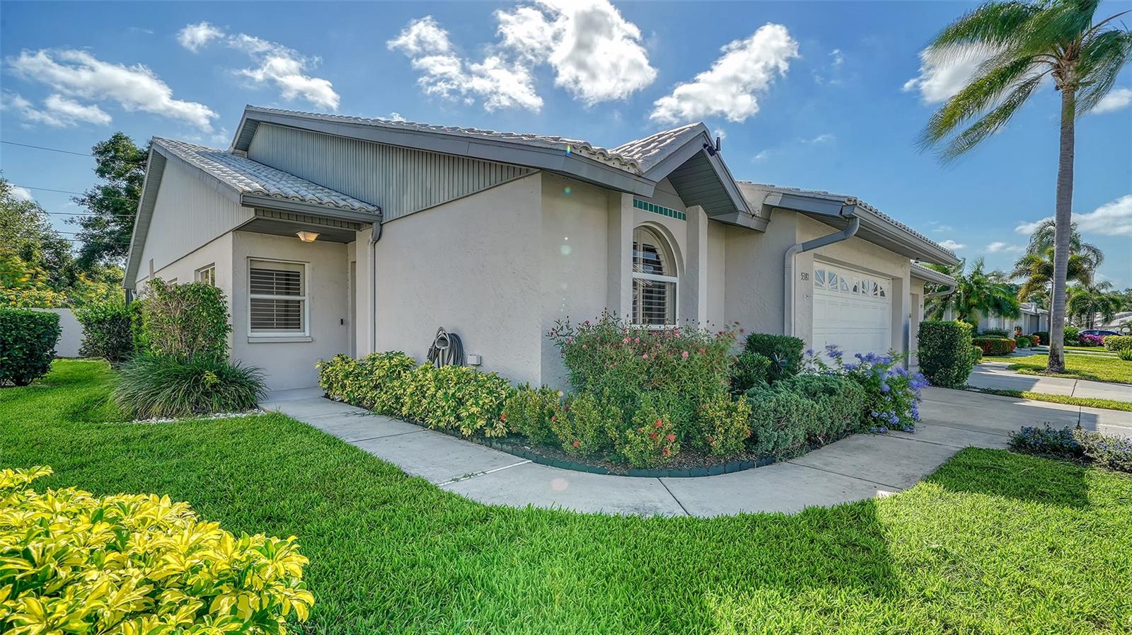 Priced for quick sale.  This Villa is 1803 sq ft with 3 bedrooms and 2 baths. Crestwood Villas is located in the popular Centergate Area close to shopping and many other amenities.  Master bath has new cabinets and granite counter tops, Kitchen has ample wood cabinet space with stainless steel appliances. Windows have plantation shutters or blinds.  There is an alarm and exterior surveillance camera system which the new owner can have activated.  The villa has a new Tile Roof. Outside screened patio is private and spacious for entertaining.   Lanai has a remote electric hurricane role down shutter. The clubhouse offers year round social events.  Play tennis or Pickleball then cool of int he shimmering pool which is geo thermal heated for those chilly days.