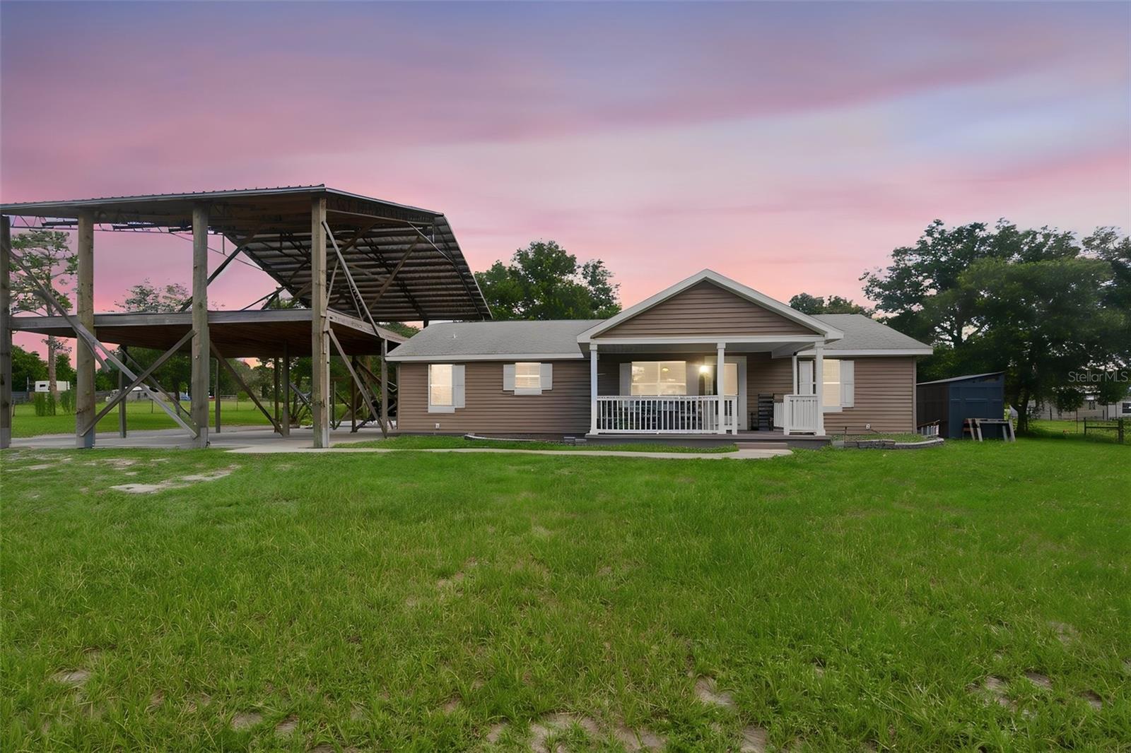 Bring your toys, your business, your horses, or your dreams of country living because this nearly 6-acre property has room for it all! Nestled on 5.92 acres in Eustis, this updated 3-bedroom, 2-bath home offers 1,624 square feet of living space along with incredible outbuildings and acreage. Inside, you'll find recently installed luxury vinyl plank flooring throughout, fresh interior paint touch-ups, and brand-new quartz countertops in the kitchen and both bathrooms. The open floor plan features spacious living and dining areas, generously sized bedrooms, and a large primary suite.

Outside is where this property truly shines. A massive 90' x 40' detached garage/workshop with four roll-up doors and two additional sliding door openings provides endless possibilities for storage, hobbies, equipment, or running a home-based business. In addition, the property features an impressive oversized RV and vehicle storage structure, perfect for boats, campers, trailers, and recreational equipment.

The land itself is equally impressive, featuring approximately 4.61 acres of beautiful, usable land along with an additional 1.31 acres of wetlands that create a peaceful and scenic natural setting. A picturesque 120' x 180' pond adds to the privacy and charm of the property, making it an ideal place to enjoy tranquil country living.

Major updates include a Goodman A/C system manufactured in 2020 and a water heater replaced in October 2024, giving buyers peace of mind. With plenty of room for animals, equipment, gardening, future expansion, or simply enjoying wide-open spaces, this property offers a rare combination of updated living space, usable acreage, and exceptional outbuildings.

For buyers seeking even more land and flexibility, the adjacent parcel at 32402 Pine Road is also available for purchase by the same owners. MLS #V4950030 consists of an additional 1.25 acres measuring approximately 100' x 550' and already includes a well, septic system, and power, creating a unique opportunity to own more than 7 acres combined.

Properties offering this much flexibility and potential rarely come available. Schedule your private showing today and discover all that 32416 Pine Road has to offer!