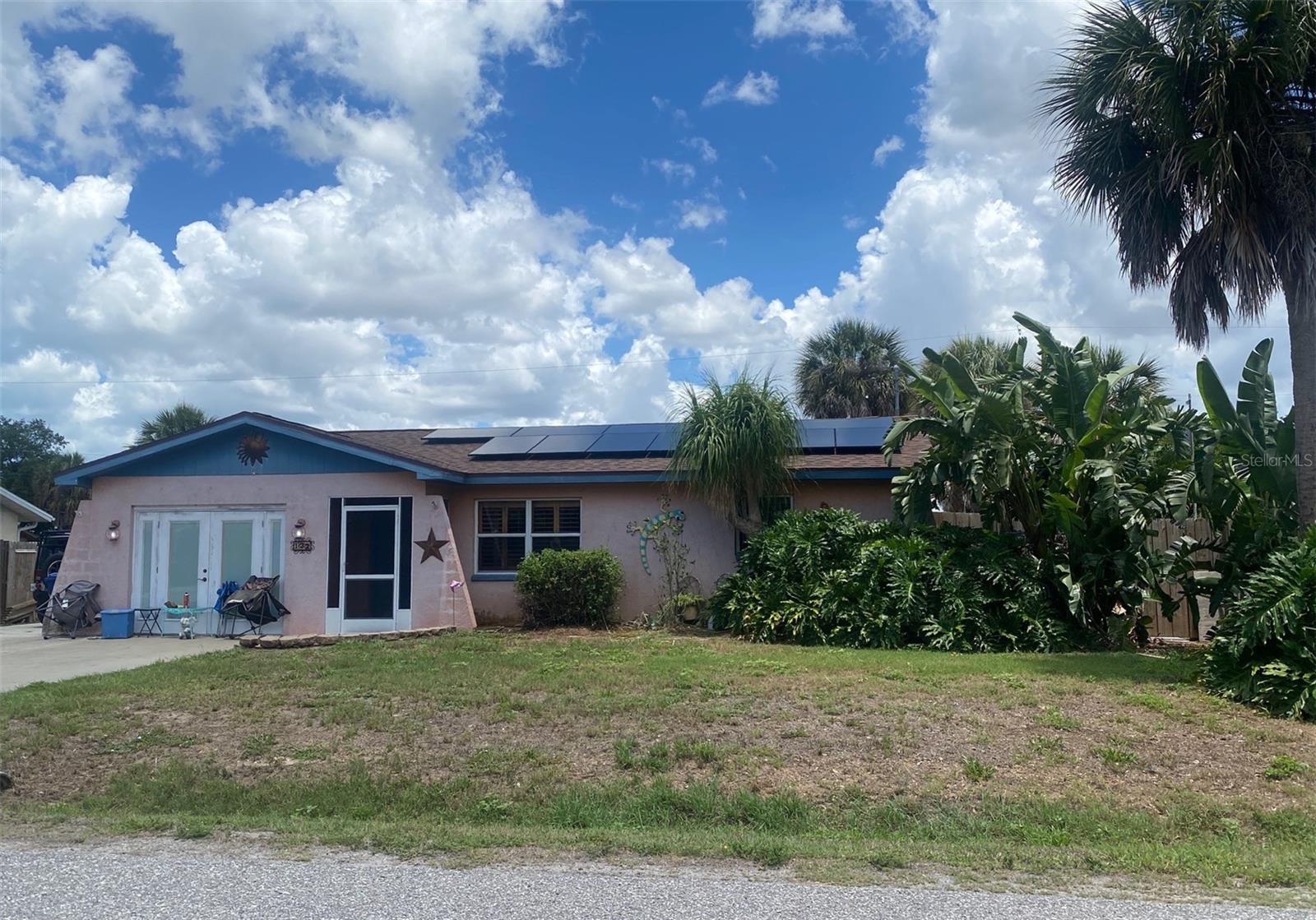 In South Venice, 3 bedrooms, 2 baths, long double driveway allows for exciting choices for you! A split bedroom plan gives lots of privacy for all. One car garage was Builders office then changed to bedroom 3. Bath 2 was added giving privacy and comfort along with remodeled kitchen with tiled countertops and breakfast bar. Dining area is adjacent to kitchen along with 9x9 bonus room between living room and dining room. Inside laundry makes your home easier to enjoy. From dining area etched stained glass French doors out to nice, screened lanai, back yard and wood privacy fence gives privacy for all. House had a newer roof approximately 5 years ago, newer electric panel and solar heating panels add to the desirability of this home. This home is within minutes to Historical Downtown Venice and Venice Beaches on the Gulf of Mexico, also, home to the Intracoastal Waterway adding multiple boating choices for your lifestyle! Large storage shed gives you lots of room to "store all your stuff!!", Driveways extend from front yard to back property line giving you tons of space for all of your toys and vehicles!