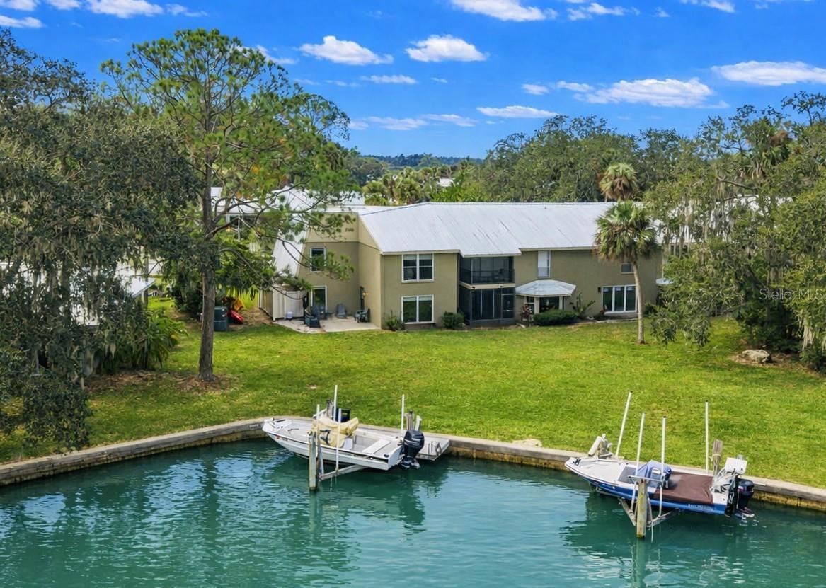 Waterfront Living with Private Dock & Boat Lift and Direct Gulf Access! Welcome to your rare waterfront retreat in The Islands at Dixie Shores! This beautifully renovated 3-bedroom, 2.5-bath end-unit condo offers direct Gulf of Mexico access via a wide saltwater canal and includes a private dock with a boat lift perfect for vessels up to 24 feet. Whether you're a boating enthusiast, avid fisherman, or nature lover, this waterfront property delivers the ultimate Florida lifestyle. Fully updated in 2025, this spacious home features sunlit living areas with panoramic water views, wood-look tile plank flooring, and elegant architectural details. The chef’s kitchen boasts granite countertops, stainless-steel appliances, shaker cabinetry, and a custom tile backsplash. Enjoy meals with a view in the dining area framed by oversized picture windows overlooking the canal. Upstairs, the owner’s suite is a serene escape with tranquil waterfront vistas, double closets, and a spa-inspired ensuite bath. Additional highlights include two new AC units, a new water heater, all new appliances, and a flood barrier doorway system for added peace of mind. The Islands condo community offers resort-style amenities including a clubhouse, heated pool, tennis courts, and comprehensive services—cable/internet, flood insurance, exterior maintenance, landscaping, termite bond, roof and road upkeep, and on-site management. Located minutes from Fort Island Beach, Three Sisters Springs, Hunter Springs, Plantation Golf Course, and public boat ramps, this turn-key property is your gateway to coastal adventure. Furnishings are available for purchase, so just bring your boat and start living the waterfront dream!