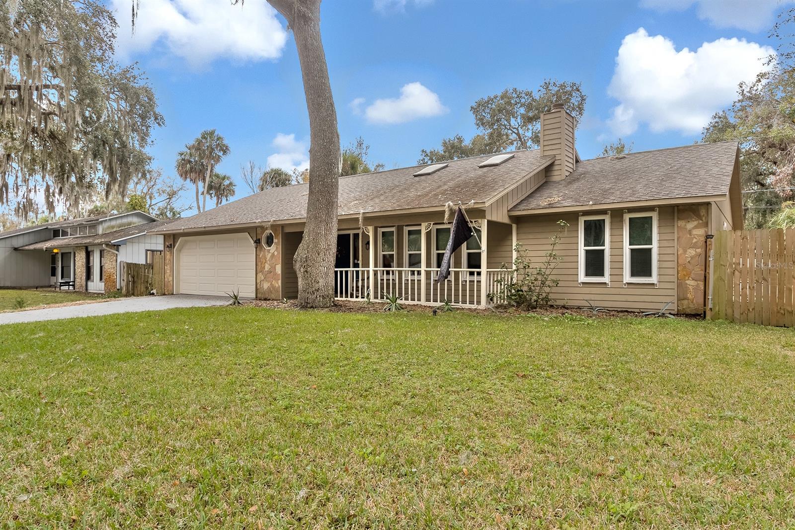 Adorable, cute as a button and this well maintained 3 bedroom ranch style home will not disappoint! Lets go. As you pull up to your new home you will notice beautiful majestic oaks casting amazing shade and adding a country feel which some only read about in books. Imagine having your morning coffee or afternoon tea on the front porch as the squirrels put on a show. Upon entry the open floor plan and cathedral ceilings boast an abundance of space and between the skylights and impact windows the natural light is a thing of beauty. Cozy up in your giant living room for a good family movie as the wood burning fire place roars giving almost a cabin in the woods feel. (AMAZING) If you enjoy cooking and love your elbow room than this is the kitchen for you. 270 square feet of space to create the most incredible meals possible. Countertops for days and cabinets galore! Newer stainless steal appliances, laminate flooring, updated light fixtures, fresh paint and an eat in area to host the overflow from the dining room. (Holy Smokes) The dining room is a perfect entertaining space and is conveniently located right off the kitchen. All bedrooms are great in size with laminate flooring, updated fixtures and just like the rest of the house freshly painted. Here is another treat the Florida room was fully enclosed with wood look ceramic tile, 2 exterior doors, a door leading into the master, new fixtures and was just painted as well. Im thinking game room, 4th bedroom, she shed or man cave here. The sweet deck out back is perfect for cook outs or whatever your heart desires.  3 year old roof, 2 year old AC and ALL the windows are impact. The back yard is huge and fully fenced. Not much more I can say about this charming diamond in the ruff except you need to come see it before its gone because this baby wont last long. Close to shopping, schools, dining, 15 mins to the beach, 5 mins from the river and only a 3 min walk to the pond. Its your turn  to say yes to the address! ;Water: City