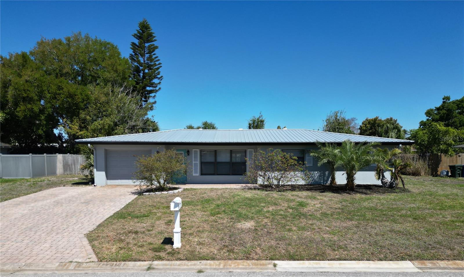 Virtually Staged. MOTIVATED SELLERS! Priced WELL BELOW the certified appraisal value, this move-in-ready home delivers instant equity and standout value in today’s market—plus a long list of brand-new upgrades you won’t have to budget for. Don’t miss this one!

Located in the highly sought-after South Gate neighborhood, this property also offers up to $8,000 in closing cost credits, making it an even stronger purchase. Step inside to an inviting open-concept layout where NEW (2026) LVP flooring and updated cabinetry create a bright, modern feel throughout. The kitchen is designed to impress with stainless steel appliances, sleek granite countertops, a contrasting travertine stone backsplash, and rich cabinetry—perfect for everyday living or entertaining.

The fully fenced backyard provides privacy and plenty of room to relax, entertain, or store your boat or RV—no HOA or CDD restrictions here.

Major upgrades include:

• LVP Flooring (2026)

• Updated Cabinetry (2026)

• Primary Bathroom Renovation (2026)

• Metal Roof (2023)

• AC (2022)

• Custom Closet Organizers (2022)

• Conversion to underground utilities + public water & sewer.

South Gate offers unbeatable location perks—just 4 miles to downtown Sarasota, 5 miles to Siesta Key Beach (ranked #1 in the U.S.), 3 miles to Sarasota Memorial Hospital, and a quick 2-mile ride to the Legacy Trail, with excellent schools nearby.

This is the total package: priced under appraisal, loaded with upgrades, and centrally located. Walk into instant equity and schedule your private showing today!