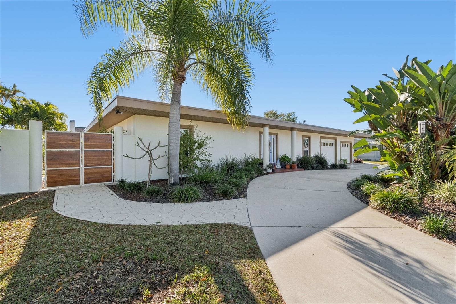 Discover a truly one-of-a-kind, Mid-Century Modern retreat where timeless architecture, natural elements, and a calming yet whimsical atmosphere come together in perfect harmony. Designed with an open, light-filled floor plan, this distinctive residence offers 3 bedrooms, 3 bathrooms, and a versatile bonus space currently used as a private office with its own private entrance—ideal as an in-law suite, guest quarters, home business, or creative studio.
Expansive telescoping sliding glass doors create a seamless transition between indoor and outdoor living, inviting the beauty of the surrounding landscape into every gathering space. Thoughtfully designed to embrace nature, the home's clean architectural lines and tranquil setting provide a peaceful sanctuary for everyday living.
At the heart of the outdoor experience is an extraordinary custom pool unlike any other, creating a private oasis perfect for relaxing, entertaining, or simply unwinding in your own Zen-inspired retreat.
Additional highlights include a brand-new roof (2025), offering peace of mind for years to come. Ideally located just minutes from downtown Sarasota, world-renowned Gulf beaches, and less than two miles from SRQ Airport, this exceptional property is perfect for those who appreciate both convenience and tranquility. Golf enthusiasts will love having the historic Sara Bay Country Club just across the street, offering one of the area's most iconic golf experiences. Schedule your private showing today and experience this meticulously maintained, lovingly cared-for home for yourself. Opportunities to own a property this distinctive are truly rare.