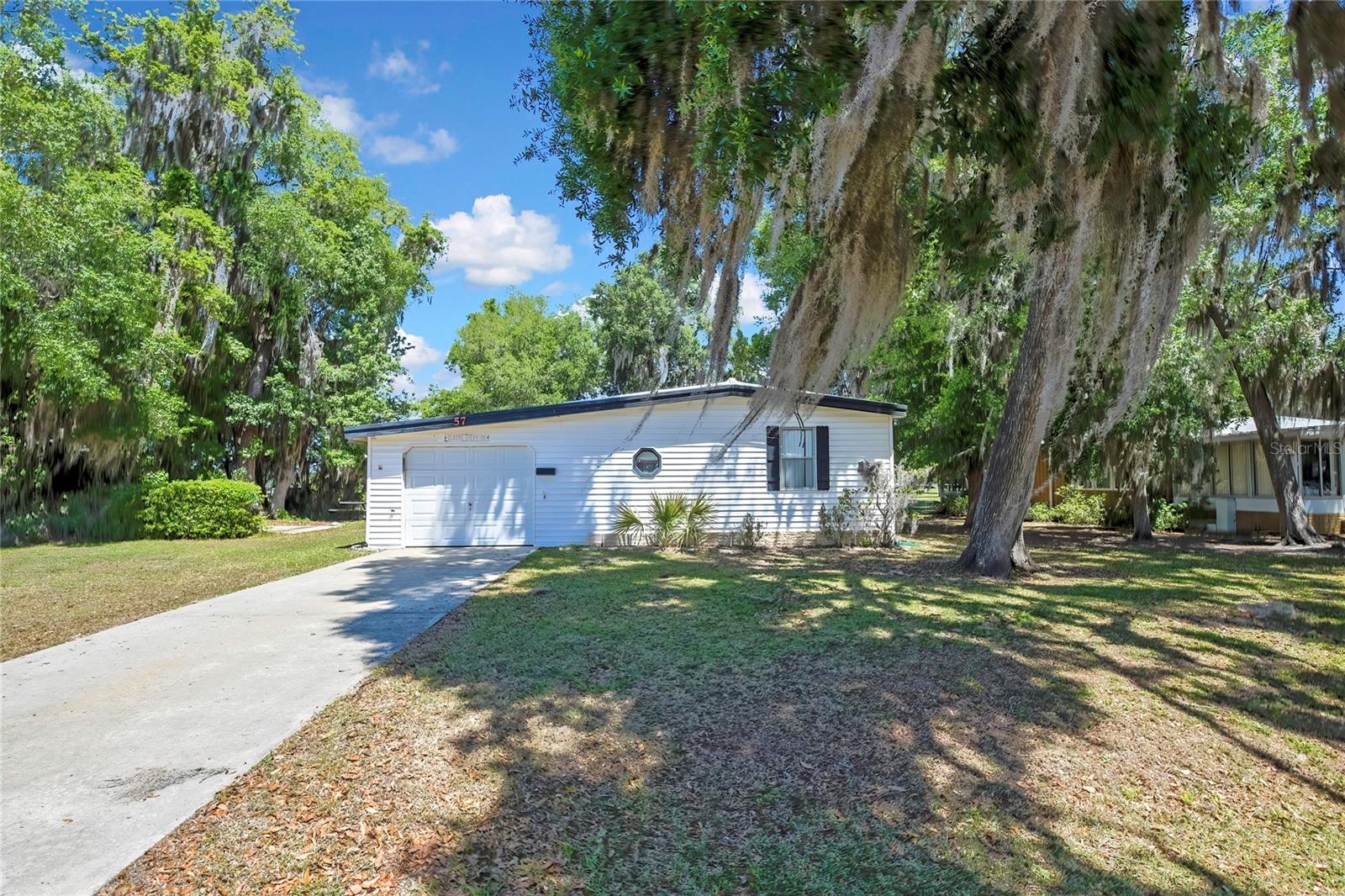 ? GOLF COURSE FRONTAGE | UPDATED LIVING | ACTIVE 55+ COMMUNITY ?

Welcome to 57 N. Bobwhite Rd, Wildwood, FL, located in the highly desirable Continental Country Club—a gated, golf cart-friendly 55+ community just minutes from Brownwood Paddock Square.

This charming 2-bedroom, 2-bathroom home offers 970 sq ft of heated living space and 1,370 total sq ft, perfectly positioned on a golf course lot with serene fairway views. Enjoy peaceful mornings and relaxing evenings from your own backyard, where the scenery provides both privacy and a true Florida lifestyle experience.

Inside, the home features a bright, open-concept layout with abundant natural light, creating a warm and inviting atmosphere. The living and dining areas flow seamlessly, making the space ideal for both everyday comfort and entertaining guests. The kitchen offers ample cabinetry and functionality, ready for your personal touch.

One of the standout upgrades is the added 1-car garage, providing secure parking, extra storage, and added convenience—an uncommon and valuable feature in this community.

Step outside to enjoy additional living space perfect for relaxing or hosting, all while overlooking the beautifully maintained golf course.

Residents of Continental Country Club enjoy resort-style amenities, including:

18-hole championship golf course
Heated pool & spa
Clubhouse with restaurant & lounge
Fitness center, library & activity rooms
Tennis, pickleball & shuffleboard courts
A vibrant calendar of social events

The HOA fee of $535.49 provides access to these amenities and supports a low-maintenance, active lifestyle.

Conveniently located near shopping, dining, medical facilities, and entertainment, this home offers easy access to everything in Central Florida, while maintaining a peaceful, community-centered feel.

Whether you're looking for a full-time residence, seasonal retreat, or investment opportunity, this golf course home checks all the boxes.

? Don’t miss your chance to own on the golf course—schedule your private showing today!