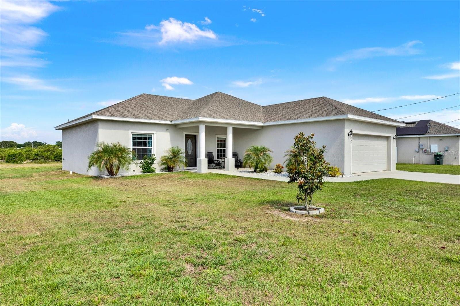 Built in 2023, this well-maintained home offers a modern layout and a convenient location across the street from Lake Lotela. The property provides easy access to nearby outdoor recreation and scenic surroundings.

Inside, the home features an open floor plan designed for comfortable everyday living and entertaining. Newer construction provides updated systems, energy efficiency, and contemporary finishes.

The backyard backs up to an orange grove with no rear neighbors, offering added privacy and a peaceful setting. Located outside of a designated flood zone. No lease restrictions are currently in place, providing flexibility for future use.

Conveniently located near shopping, dining, and other local amenities.