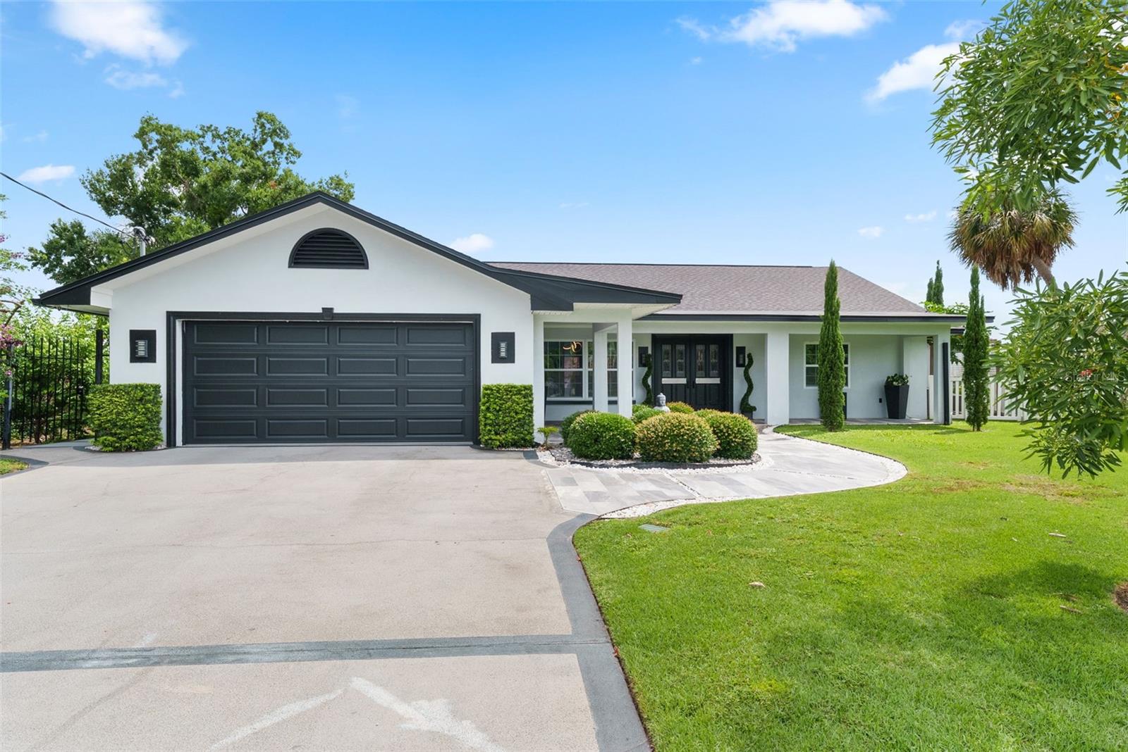 Experience the perfect blend of luxury, comfort, and waterfront living in this beautifully updated 5-bedroom, 5-bathroom residence. Upon entering, you're welcomed by an open-concept floor plan designed for both everyday living and entertaining. The expansive kitchen serves as the heart of the home, featuring an oversized island, abundant cabinetry, generous counter space, and seamless flow into the family room and dining area, all overlooking the water and creating an inviting atmosphere for gatherings large and small. The first-floor primary suite offers a private retreat complete with a spacious walk-in closet and a well-appointed bathroom. A stylish electric fireplace adds warmth and character to the space, while the adjoining sitting room showcases expansive lake views, creating the perfect setting for a home office, reading nook, or quiet escape. Two additional bedrooms and two full bathrooms are also located on the main level, providing flexibility and convenience for family and guests. Upstairs, you'll find two generously sized bedrooms, each with its own en-suite bathroom, offering privacy and comfort for visitors or multigenerational living. With approximately 3,500 square feet, the thoughtfully designed layout provides ample space while maintaining a warm and welcoming feel throughout. Step outside to discover the true highlight of the property. A covered lanai spans much of the rear of the home, creating an ideal setting for outdoor dining, entertaining, or simply enjoying the peaceful waterfront backdrop. Beyond the lanai, the backyard leads to your private concrete dock on Lake Egypt, offering direct access for boating, fishing, paddle boarding, or taking in the serene lakefront setting. Additional features include a two-car garage and a 2025 roof, providing peace of mind for years to come. Offering a rare combination of updated interiors, generous living space, and private waterfront access, this exceptional property presents an outstanding opportunity to enjoy one of Tampa's most desirable lakefront lifestyles.
