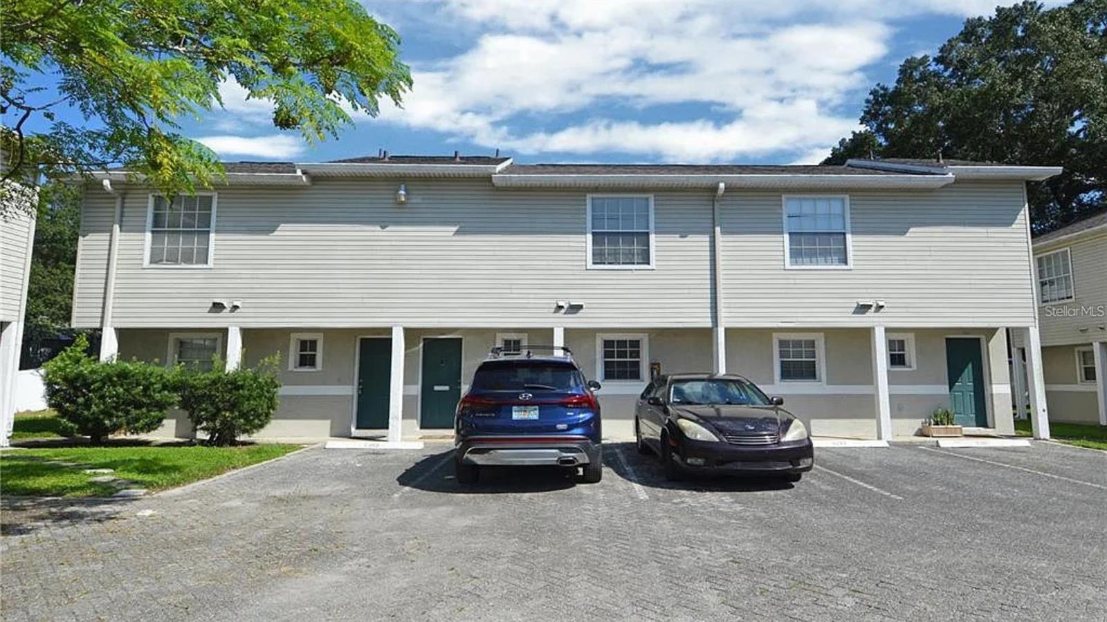 Welcome to Tropical Gardens, a beautifully maintained townhouse community in the heart of Tampa, conveniently located just off N. Dale Mabry Highway. This spacious 2-bedroom, 2.5-bathroom townhome features two private master suites, each with its own en-suite bathroom and walk-in closet, offering the perfect blend of comfort and privacy. The first floor boasts soaring ceilings, a bright and open living and dining room combination, a convenient half bath, a full-size stackable washer and dryer, and tile flooring throughout. Step outside to enjoy your own private fenced backyard, ideal for relaxing or entertaining. Upstairs, both bedrooms feature vaulted ceilings, walk-in closets, and private bathrooms. Located just minutes from Tampa's premier shopping, dining, arts and entertainment, Raymond James Stadium, Downtown Tampa, South Tampa, Tampa International Airport, and some of Florida's beautiful Gulf Coast beaches, this home offers exceptional convenience and an unbeatable location.