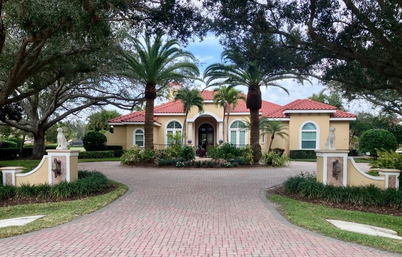 An exceptionally well maintained 4,012sf residence with 4 bedrooms 3 full and a half baths situated on the interior Heron golf course on a 0.61 acre lot in the private Oaks Club community. It has golf course and water views and 24 hr gated security. This custom golf course home was built by esteemed builder Arthur Rutenberg. It represents Rutenberg at his very best - stylish elegance, superior craftsmanship designed to accommodate the seamless indoor-outdoor transfer so critical to Florida living. Most prominently the home features 12 foot high ceilings in most rooms, designed to maximize the home's grander, air flow and natural light. The previous owners called it "The House of Light”. The Rutenberg influence abounds in other stunning details starting with the lighted entrance posts, the dramatic circular driveway and the centrally located kitchen that seamlessly opens to a comfortable family/TV room. The home has magnificent coffered ceilings, distinctive crown molding and a gas fire place. Its oversized screened lanai encompasses substantial undercover space for family and guest dining. It is visually highlighted by a 4 foot high tile wall at the head of the pool with a waterfall feature. The kitchen is a cooks delight with new granite counters, stainless steel appliances, including SUBZERO and WOLF. The master bathroom has dual vanities and a large custom tiled shower and soaking tub. The oversized 3 car garage has amble storage capacity, a work table and a refrigerator. Mr. Rutenberg would be pleased to know that this meticulously crafted home has been skillfully updated over the years by all its owners. These improvements include - 1.) hurricane windows and doors (2020), 2.) Roof (2019), 3.) Cage - aluminum structure (2018) 4.) Screened under-cover outdoor grilling area - granite tops, refrigerator, seating for 4, Alfresco grill (20xx). The Oaks has been a member owned private residential golf club for over 40 years. It boosts many accolades, including being the only private residential golf club in the Sarasota/Bradenton/Fort Myers area recognized for high achievement by both Platinum Clubs of America and Distinguished Emerald Clubs of World. It has also been recognized as “The Healthiest Club" and is a certified Audubon Society award recipient. The club has a magnificent 30,000 square foot club house, three exquisite dinning venues, two 18 hole well maintained championship golf courses featuring excellent professional instruction, an outstanding racquets program with 12 har-tru Hydo Grid courts, 4 pickle ball counts, a vibrant croquet program with a regulation sized lawn, a state-of-the-art (newly expanded) wellness/fitness/spa facility, a junior olympic swimming pool, Bocce and a basketball court. Families with children are very welcome here. The Oaks Club’s ideal Sarasota County location places it minutes away from - Sarasota’s vibrant arts and cultural scene and great shopping. It also provides easy access to the expanded Sarasota airport, world class medical care and some of the most beautiful beaches in the world. There is no waitlist for membership.