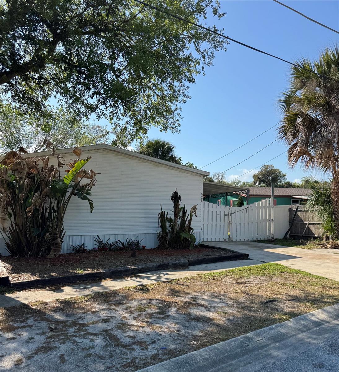 2001 Manufactured Home awaits! Waterfront Opportunity in Pt Orange – No HOA! Can be an investment! Wake up to peaceful water views and end your day and relax. This charming waterfront home in Pt Orange offers the perfect blend of relaxation, lifestyle, with investment opportunity. This inviting home features an open-concept layout that connects to the living room, dining area, and kitchen, creating a bright and spacious feel. Natural light fills the home, while the water views relax you with privacy that is hard to find at this price. YES! You can fish all day and night! The kitchen offers plenty of counter space, appliances, making it perfect for everyday living & entertaining. Whether you're cooking dinner or enjoying your morning coffee, you'll love the peaceful canal views right outside. This home includes three comfortable bedrooms, including the main bedroom with a private en-suite bathroom, creating a relaxing retreat. The split plan makes the bedrooms perfect for your growing family, friends, home office, hobby room or whatever works for you. Step outside and enjoy your backyard including your private waterfront view. Great for entertaining, gardening, relaxing, fishing or feeling the breeze. Canal access is easy! This property offers natural Florida lifestyle you may only dream about. Even better NO HOA, making this property your home, investment, rental, or seasonal home all you turn it in to. Waterfront properties with no HOA are becoming harder to find, in such great location.  Port Orange is close to shopping, restaurants, parks, the beach and great medical facilities. At this price point, what a great place to start or downsize to! Wonderful school system if that is a concern. Schedule your showing today!  All information is believed to be accurate but should be verified by the Buyer and Buyer Agent.
