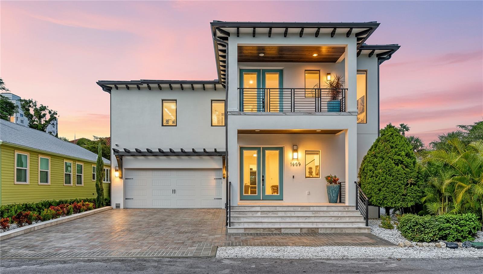 One or more photo(s) has been virtually staged. Welcome to Downtown Sarasota luxury living at its finest. Perfectly positioned in the highly sought-after Laurel Park neighborhood and Southside Elementary school district, just steps from Historic Burns Court, Marie Selby Botanical Gardens, Bayfront Park, Marina Jack, and only minutes to Lido Beach and St. Armands Circle, this custom-built 2024 coastal modern residence offers an exceptional blend of sophistication, comfort, and walkable downtown convenience. Designed for those who value effortless entertaining and an active Sarasota lifestyle, this meticulously constructed two-story residence spans 2,754 square feet and features four bedrooms, three and a half baths, a heated saltwater pool, outdoor kitchen, and thoughtfully curated designer finishes throughout. The heart of the home showcases an expansive open-concept living space centered around a chef's kitchen appointed with premium Thermador stainless appliances, gas cooking, built-in coffee and beverage center, oversized island seating for seven, walk-in pantry, dedicated ice maker, dual wine refrigeration accommodating over 200 bottles, and seamless indoor-outdoor flow ideal for entertaining. Step outside into a private resort-inspired setting where textured stucco privacy walls frame a heated saltwater pool with waterfall feature, fountains, ambient lighting, covered entertaining spaces, outdoor kitchen, pool bath, and outdoor shower.
Constructed entirely of concrete block and engineered for peace of mind with CAT 5 hurricane windows, metal roof construction, whole-house Generac generator, water filtration systems, and exceptional finish quality throughout.
The second level owner's retreat creates a private sanctuary with spacious walk-in closet and spa-inspired bath, while two guest suites share a beautifully appointed Jack-and-Jill bath. A first-floor bedroom with adjacent full bath offers flexibility for guests, office, fitness, or multigenerational living. Additional features include marble exterior decking, porcelain tile balconies, epoxy garage flooring, irrigation system, quartz surfaces throughout, and premium construction rarely found in downtown Sarasota.  Leave the car behind and experience Sarasota the way it was meant to be lived — morning walks to Selby Gardens, evenings in Burns Court, waterfront sunsets along Bayfront Park, and effortless access to world-renowned beaches.  Luxury. Lifestyle. Location.  1659 Devonshire Lane delivers all three. Some photos have been virtually staged.  All measurements are approximate and should not be relied upon as exact.
