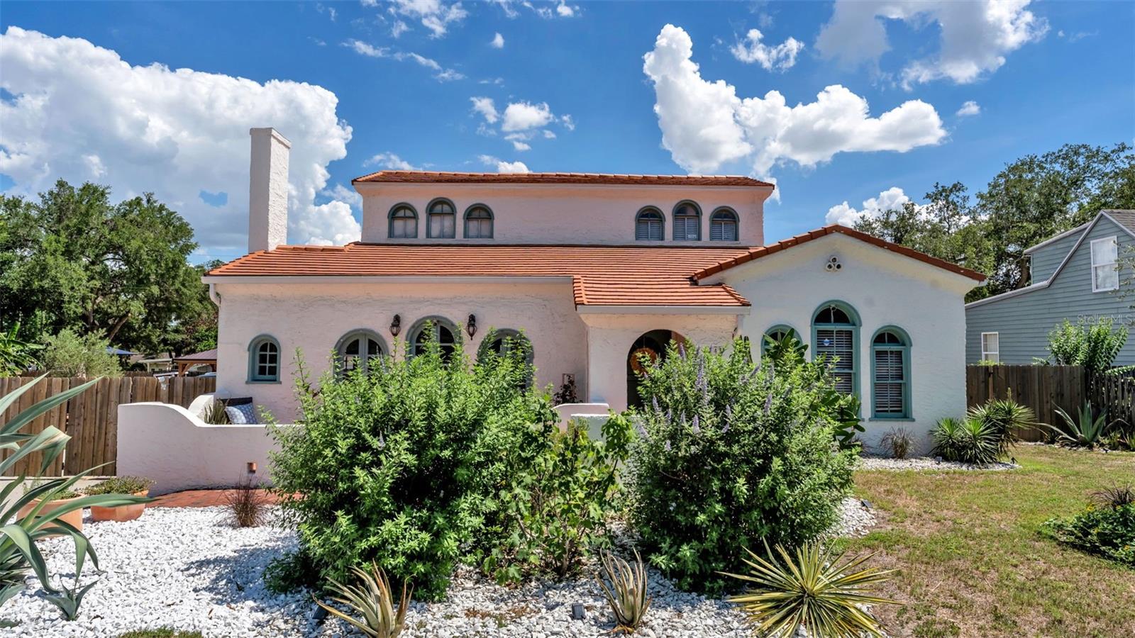 Step into the perfect blend of timeless charm and modern sophistication in this meticulously renovated historic Spanish-style home, where every detail has been thoughtfully curated to preserve its original character while introducing luxurious modern upgrades. From the moment you arrive, you’re welcomed by a stunning newly updated terracotta tile entry and tiled staircase that set the tone for the home’s warm, elegant design. The completely remodeled custom kitchen serves as the heart of the home, showcasing designer tilework, quartz countertops, soft-close cabinetry, stainless steel appliances, and a custom island thoughtfully designed to complement the home’s historic aesthetic. Natural light fills the living spaces, enhanced by designer lighting throughout. Enjoy peace of mind with extensive updates including all-new 2023 plumbing, a 3-stage whole-house water filtration system, 2023 HVAC with new ductwork, a 2019 clay tile roof, and new dual-pane windows in the downstairs bedrooms, kitchen, dining room, and laundry room. A newly added laundry room features a high-efficiency washer and dryer on pedestals framed by one-of-a-kind antique French doors. The newly added mudroom opens to your own private fully fenced backyard, which is designed for both entertaining and everyday enjoyment. Centered around the beautifully refinished saltwater pool, this expansive outdoor space invites you to relax, gather, and enjoy the Florida lifestyle year-round. The newly added pergola creates the perfect setting for outdoor dining, poolside lounging, and BBQs. There is also a custom-built swing set. This property offers abundant room to grow your own vegetables and a even a custom-built chicken coop, so bring your chickens and enjoy fresh eggs at home year round!! A newly constructed zig-zag staircase and deck lead to the turnkey 2025 fully updated 420 SqFt ADU apartment suite. It features a private entrance, full kitchen, in-unit laundry, a mini-split system, and a new water heater, making it ideal for guests, multigenerational living, or income potential. Beneath the ADU, an additional 580 SqFt pool house with water and electricity offers endless flexibility as a game room, gym, studio, workshop, or hobby space. Additional highlights include fresh interior and exterior paint, expanded concrete driveway parking, and a fully fenced yard with an automatic gate for privacy and security. Best of all, enjoy the freedom of NO HOA. Ideally located near scenic lakes and parks and just minutes from downtown Lakeland’s dining, shopping, and cultural attractions, this one-of-a-kind property offers the rare opportunity to enjoy historic character, modern comfort, and an incredible lifestyle all in one.