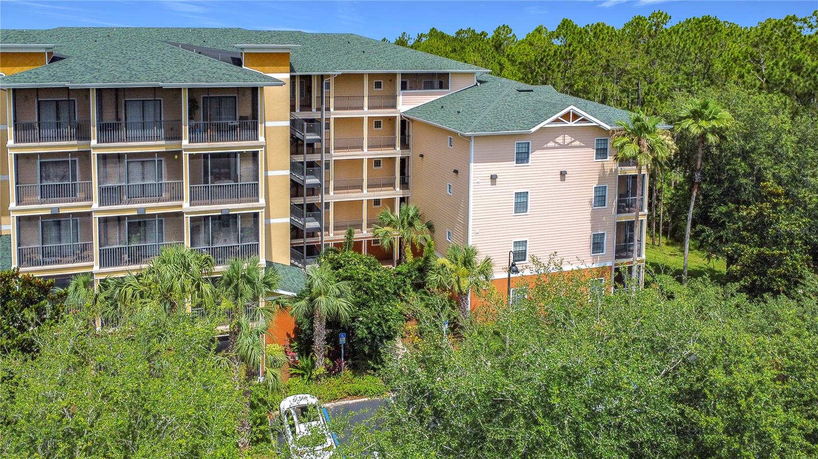 Beautifully updated 2 bedroom, 2 bath condo located in the desirable Caribe Cove Resort community. Step inside to find fresh new LVP flooring in the living and dining rooms, new carpet in the bedrooms, newly painted interior, and brand new stainless steel appliances. The primary suite is spacious with a large en-suite bathroom which has a soaking tub, separate shower, walk in closet and a small private balcony. The second bedroom is generously sized. Enjoy your morning coffee or evening relaxation from the large, private screened-in balcony, which overlooks a peaceful, wooded view providing added privacy. This condo is located in one of the most desirable buildings in the community, tucked quietly at the back with a serene setting that includes a small community pond and a wooded backdrop. Sold partially furnished. The Caribe Cove Resort offers fantastic amenities including a resort-style pool, hot tub, clubhouse, and fitness center. Ideally situated just minutes from Disney, area theme parks, shopping, dining, golf, and all that the Orlando / Kissimmee area has to offer. This condo is move in ready and is perfect as a primary residence, vacation getaway, or investment opportunity. Don’t miss your chance to own in one of the area's most convenient and well priced resort communities!