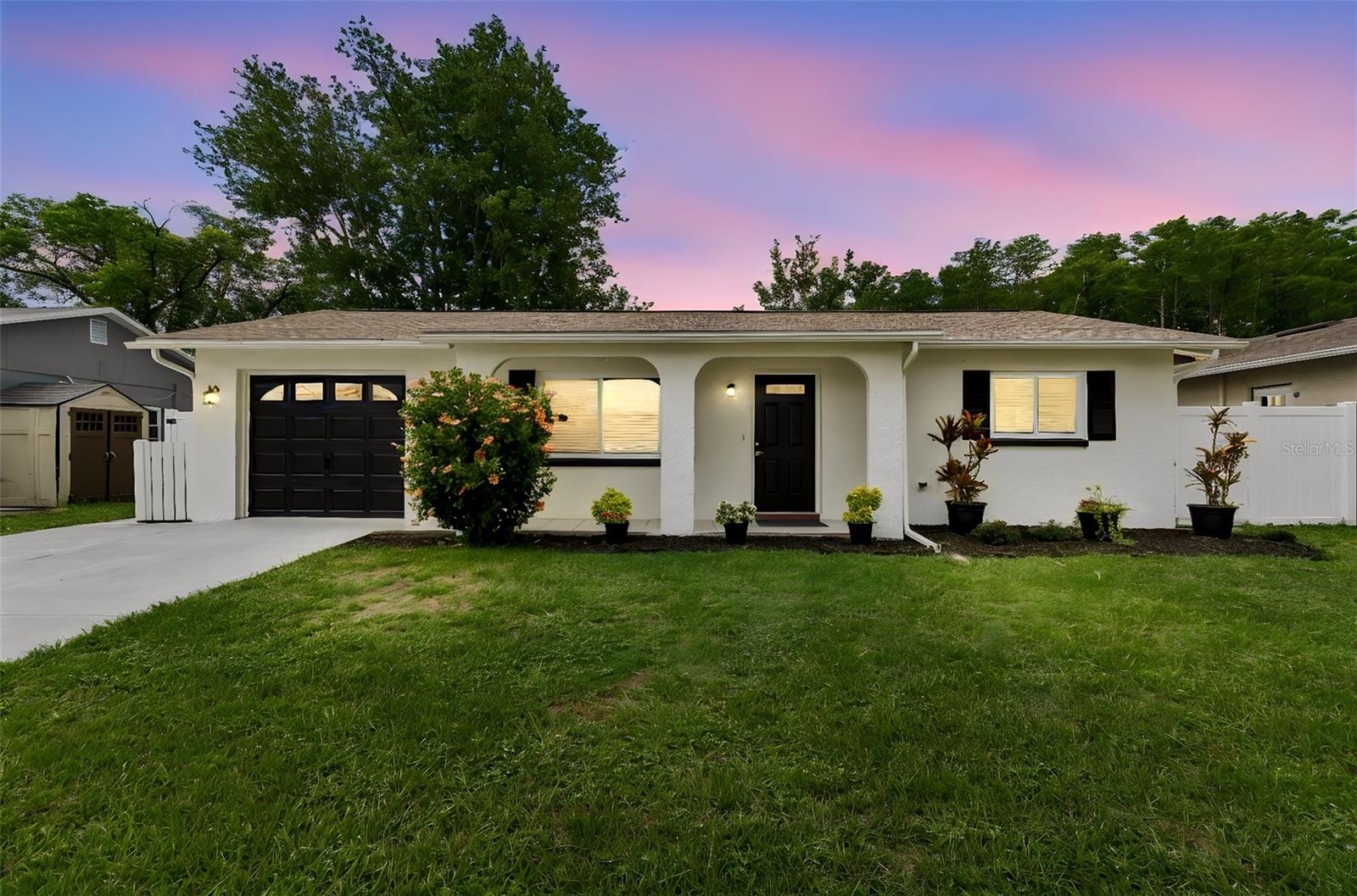 Welcome to this move-in-ready 3-bedroom, 2-bath home with a den that could easily serve as a 4th bedroom. The current garage conversion provides additional living space and can be converted back to a garage if desired, as the garage door remains in place.

Perfectly situated on a scenic waterfront pond, this fully fenced property has been extensively updated throughout. Major improvements include a new roof in 2023, fresh interior and exterior paint, luxury vinyl plank flooring throughout the living areas, and tile flooring in both bathrooms. Additional upgrades include all new 6-panel interior doors, updated baseboards, modern lighting fixtures, the removal of popcorn ceilings for a clean, contemporary feel, and energy-efficient double-pane windows and sliding glass doors.

The beautifully remodeled kitchen features quartz countertops, stainless steel appliances, a large stainless farmhouse sink, abundant cabinetry, and plenty of workspace for cooking and entertaining.

The primary suite offers a fully renovated bathroom with a double vanity, new toilets, updated fixtures, and a stunning walk-in shower finished with tile extending to the ceiling. The guest bathroom has also been completely updated with new tile flooring, a tiled shower surround extending to the ceiling, a new toilet, and a stylish anti-fog illuminated mirror.

Designed for comfortable living and entertaining, the home offers multiple gathering spaces including a living room, family room, and dining area. Step outside to the rear patio and enjoy peaceful waterfront pond views from your fully fenced backyard—the perfect setting for morning coffee, evening relaxation, family gatherings, or entertaining friends.

Conveniently located near local beaches, parks, shopping, restaurants, and schools, this beautifully updated home offers the perfect combination of comfort, style, and location.