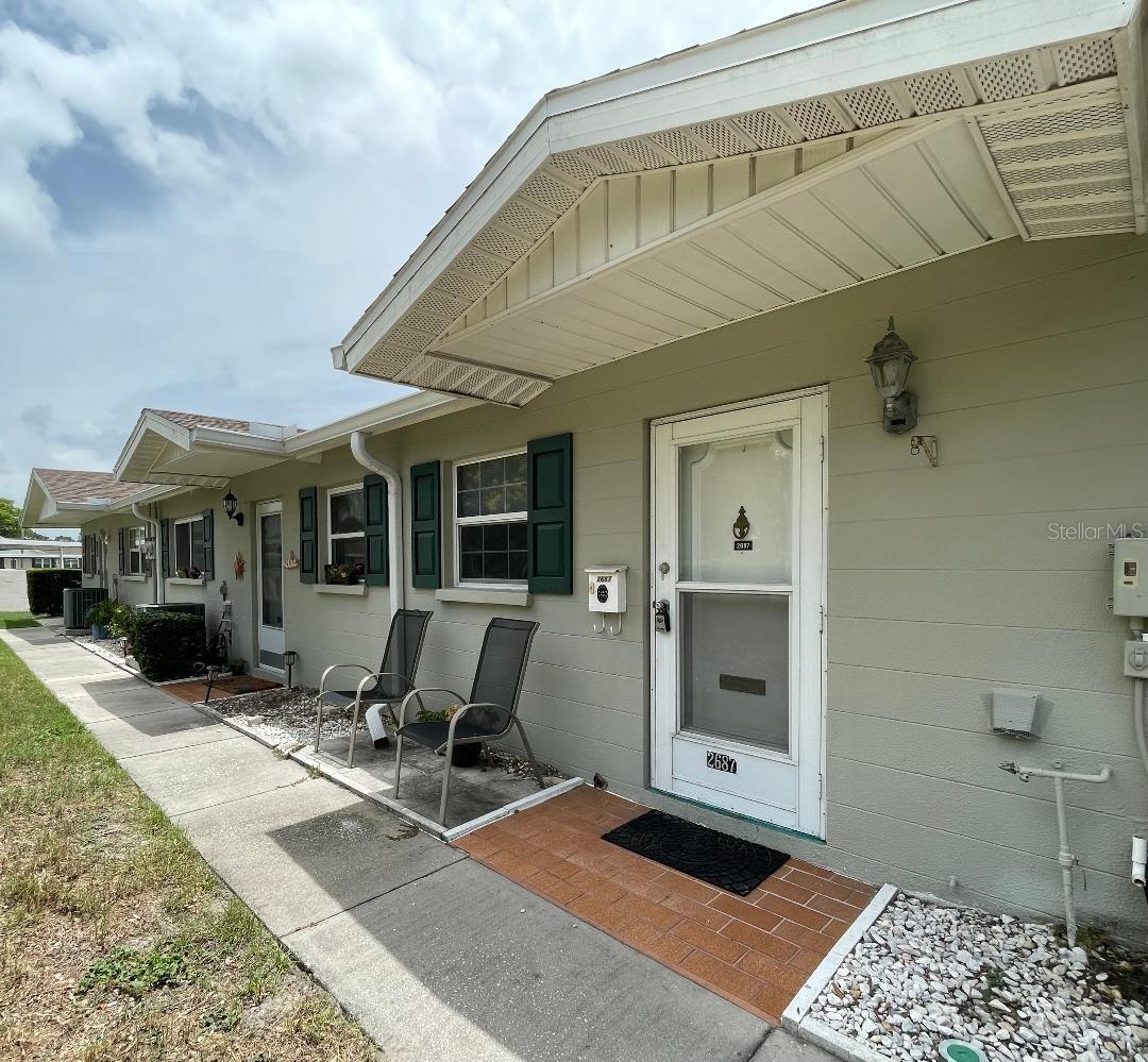 This 2 Bedroom, 2 Full Bathroom Ground Floor Condominium Can Be Enjoyed For Full-time Living Or For Seasonal Enjoyment To Bask In The Sunshine Of Winter! This 55+ Community Features: Solar Heated Community Pool, Shuffleboard, Library, Clubhouse w/Kitchen and Activities Room for Fun Social Events. Leasing Is Permitted (Restrictions Apply). HOA Fees Includes Condo Roof, Exterior Paint & Maintenance, Lawn, Cable TV, Sewer/Trash/Water, Pest, Plus One Assigned Covered Carport Parking Space w/Storage Cabinet. No Hurricane Damage to Unit. Images Include Virtual Staging For Visual Purposes.