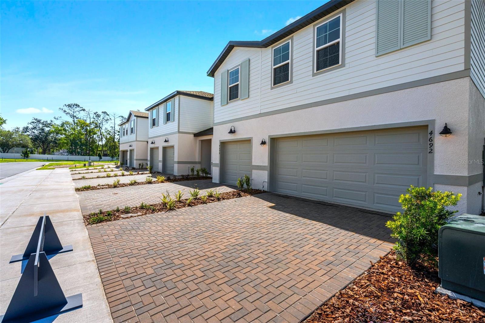 Under Construction. Estimated Completion: September 2026. Welcome to Shenandoah Reserve, where low-maintenance living meets the best of East Orlando. Conveniently located near major highways, top dining, entertainment, and outdoor recreation, this community offers both comfort and accessibility. This Abbey townhome is a 3-bed, 2.5-bath interior floorplan that features a covered lanai, beautiful pond view, spacious upstairs loft, and modern design finishes throughout. From the moment you arrive, the two-car paver driveway and lead walk welcome you to the covered front porch, setting the tone for timeless curb appeal. Step inside through the impressive 8’ front door and experience soaring 9'4" ceilings that enhance the open, airy feel of the main living space. Sleek Ventura Tile flooring made to look like wood finishing throughout the first floor delivers both durability and modern style. At the heart of the home, the chef-inspired kitchen makes a bold and elegant statement with quartz countertops and 42” linen painted cabinetry. The spacious center island provides the perfect gathering space for entertaining or casual dining. A generous walk-in pantry ensures everything has its place. The kitchen flows seamlessly into the dining area and great room, creating a bright, open-concept layout designed for both entertaining and everyday living. A triple sliding glass door extends your living space outdoors to the expansive covered lanai—ideal for relaxing evenings, weekend gatherings, or enjoying Florida’s year-round sunshine. Upstairs, a spacious loft provides flexible living space perfect for a home office, media room, or play area. A large walk-in laundry room adds convenience, while two secondary bedrooms share a full bath. The private primary suite is thoughtfully positioned and features a generous walk-in closet and an oversized bath complete with a dual-sink vanity, private shower, and separate water closet for added comfort. Residents of Shenandoah Reserve enjoy low HOA fees, no CDD, and community amenities including a dog park, playground, walking trail, and gathering areas—all designed for relaxed, low-maintenance living. Ask about our closing cost incentives! DISCLAIMER: Photos and/or renderings are for illustrative purposes only and may depict upgraded landscaping, elevations, decorative features, or optional upgrades that may not be included in the home offered. Pricing, Incentives and Promotions are subject to change at anytime. Promotions cannot be combined with any other offer. Ask the Sales and Marketing Representative for details on promotions.
