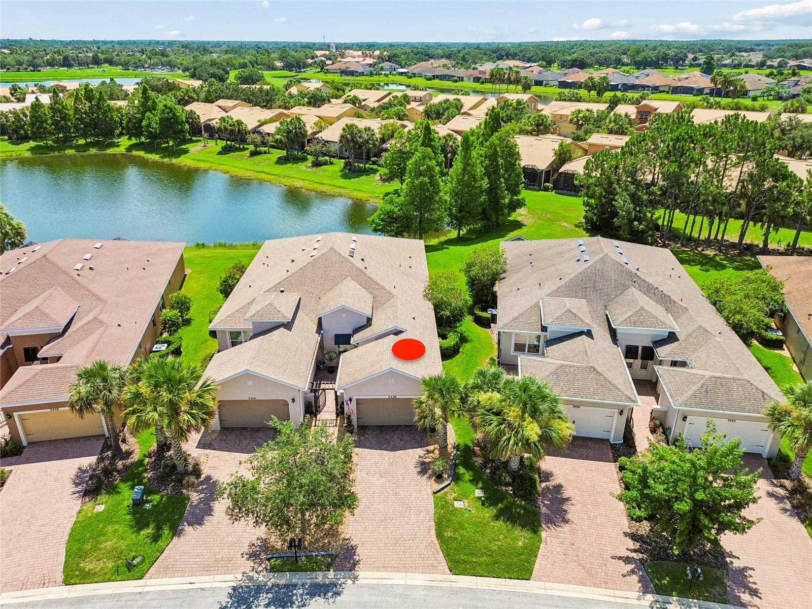 Welcome to this beautiful 2015 Avellino model offering 2 bedrooms, 2 baths, and a DEN and tranquil POND VIEWS in the highly sought-after Courtyards of Montelena. Ideally located just minutes from the Village Center, this move-in-ready home combines a premium location with exceptional upgrades and low-maintenance living. From the moment you arrive, you'll appreciate the home's inviting curb appeal, highlighted by decorative rock landscaping, oversized potted plants, and LANDSCAPE LIGHTING . A private, welcoming front courtyard creates an ideal space for morning coffee or relaxing evenings. Inside, the welcoming foyer opens to a versatile den, perfect for a home office or hobby room. The OPEN-CONCEPT plan is enhanced by 18-inch TILE throughout the main living areas and wet areas, with LUXURY VINYL PLANKING flooring in the bedrooms. The stunning upgraded kitchen features 42-inch cabinetry, QUARTZ countertops, elegant GLASS PENDANT LIGHTING, a decorative glass tile backsplash with a mosaic accent above the range, a GRANITE COMPOSITE SINK with an UPGRADED FAUCET, an UNDER-SINK ELECTRIC WATER HEATER that provides instant hot water at the sink, a closet pantry with ROLL-OUT SHELVES, and newer appliances (2025). The appliance package includes an INDUCTION RANGE and a Samsung smart refrigerator with customizable glass front door panels and a dual auto ice maker. The breakfast bar overlooks the dining room, making entertaining effortless. Wake up to peaceful water views from the spacious PRIMARY SUITE, complete with custom BUILT-IN cabinetry, a walk-in closet, and an elegant ENSUITE BATH featuring DUAL RAISED VANITIES with GLASS VESSEL SINKS, upgraded mirrors and lighting, and a large WALK-IN SHOWER with a built-in bench. The private guest bedroom is located at the front of the home and is adjacent to a beautifully updated guest bath with a QUARTZ VANITY, glass vessel sink, upgraded fixtures, and a tub/shower combination accented with decorative glass tile. Step outside to the covered, SCREENED lanai with desirable EASTERLY exposure, where you can enjoy breathtaking sunrises over the tranquil pond while enjoy your morning coffee. A separate laundry room includes the WASHER AND DRYER. Additional upgrades include upgraded lighting and ceiling fans throughout, 8-foot interior doors, rounded corners, and a Culligan whole-house WATER SOFTENER SYSTEM. This exceptional home is truly move-in ready and offers the perfect opportunity to enjoy the award-winning Solivita lifestyle, featuring championship golf, resort-style pools, fitness centers, tennis, pickleball, walking trails, restaurants, and over 200 clubs and activities. Don't miss your chance to own this beautifully upgraded home with serene water views in one of Solivita's most desirable neighborhoods! The HOA: - maintains the LANDSCAPING & IRRIGATION systems in the common areas as well as at individual homesites - maintains the roads throughout the community - PROVIDES SECURITY with gate guards and mobile patrols including the Polk County Sheriff - allows AUTOMATED GATE ACCESS for residents via license plate readers - provides residents with Fiber Optic Internet & TV service.***Poinciana Lakes Plaza is a MAJOR NEW SHOPPING CENTER that opened directly across from the Solivita Main Gate in Summer of 2024. It features Sprouts Grocery, TJ MAXX, Ross, Burlington, Rack Room Shoes, 5 Below, Ulta, Outback, First Watch, 5 Guys, Urgent Care, Dentist, TD Bank, Petco & Hair Cuttery PLUS MORE TO COME.***