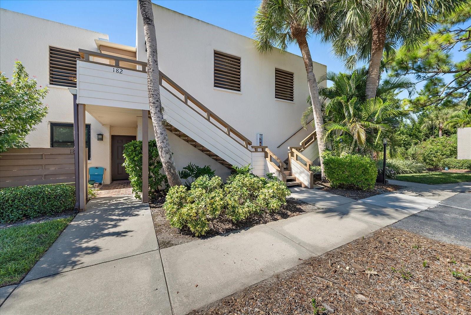 Set within the peaceful, tree-lined community of Wildwood Springs in Bradenton, this spacious lakefront two-bedroom, two-bath condominium offers the perfect blend of comfort, convenience, and Florida charm. Positioned on the second floor, the home captures serene lake views and features the added benefit of in-unit laundry. Significant recent upgrades elevate the property’s appeal, including a 2024 roof, 2024 impact-rated windows, and a new HVAC system installed in 2023—providing enhanced efficiency, durability, and year-round comfort. Generous interior storage further enhances everyday livability. Residents of Wildwood Springs enjoy an exceptional lifestyle with access to two sparkling community pools, tennis courts, and a pickleball court, all surrounded by lush, mature landscaping that defines this sought-after neighborhood. Ideally located near IMG Academy, the pristine beaches of Anna Maria Island, and an array of shopping and dining options, this condo offers both a tranquil retreat and a smart investment opportunity. With its recent updates and inviting setting, it’s ready to be transformed into your ideal Florida home.