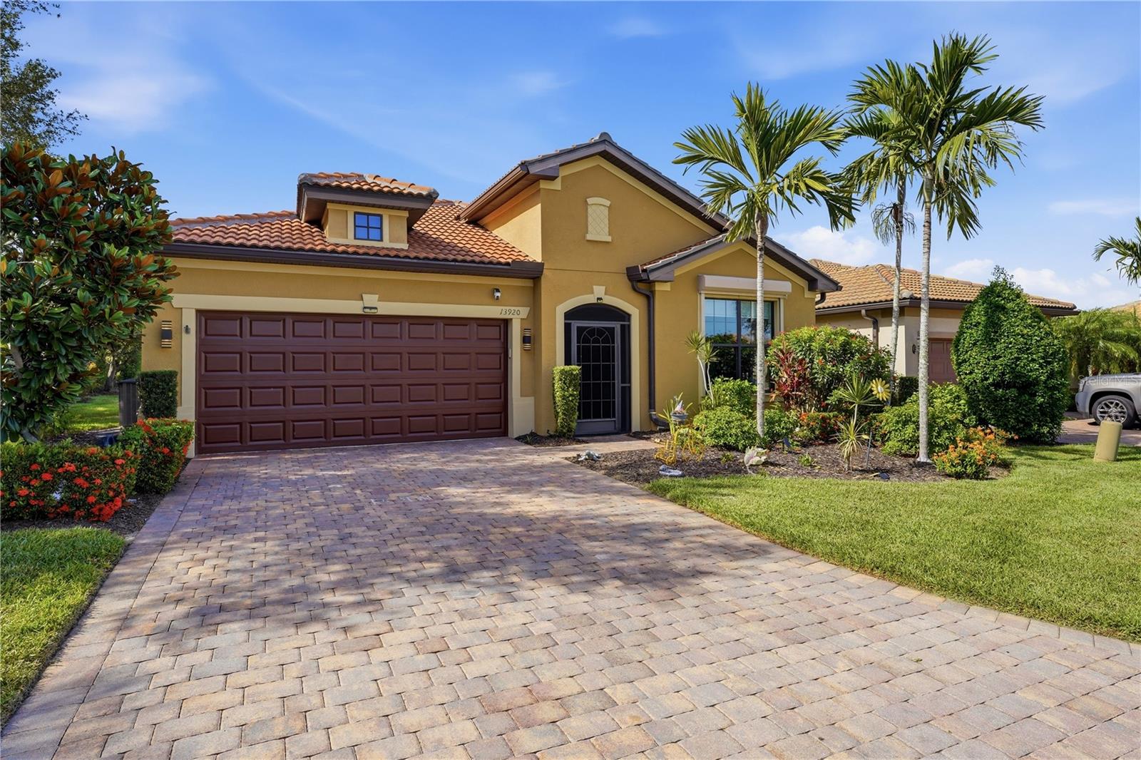 This is a beautifully maintained residence built in 2015, in the gate with guard community of Island Walk in Venice, Florida. This furnished home offers 1792 square feet of thoughtfully designed living space with two bedrooms and bathrooms a den that could be used as a third bedroom. There is an additional room off of the kitchen that has tons of possibilities.  This is an open concept floorplan that blends comfort, functionality and Florida lifestyle living. This property features ceramic tile throughout, crown molding, granite countertops, stainless steel appliances, a large counter with seating in the kitchen, crown molding, ceiling fans throughout, a whole house water filtration system, a large lanai, screened in porch, epoxy flooring in the garage, gutters and a view of a pond in the rear. It also comes with hurricane shutters. The Island Walk Community is a gated community that offers a security guard, clubhouse, two pools, fitness center, pickle ball and tennis courts, a dog park, playground and more.
