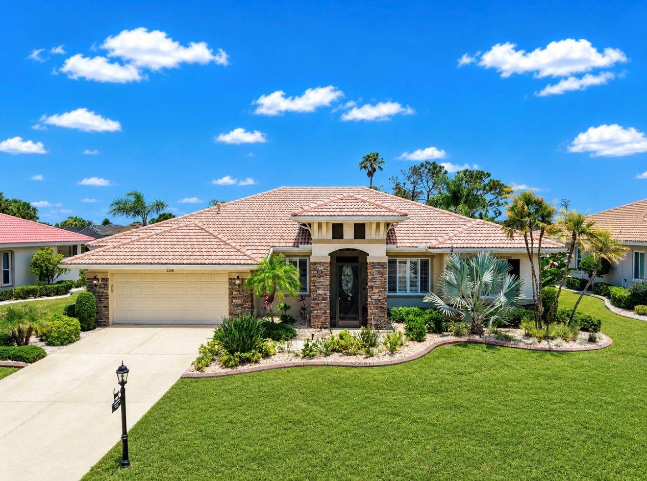 Talk about stunning! Welcome to this exceptional home located at 2208 Myrtle Vista Court in the highly sought-after Renaissance area of Sun City Center. From the moment you arrive, the curb appeal impresses with beautiful native landscaping, a tile roof, stacked stone accents, and a charming front screened entry accented with a color changing choice architectural lighting system for evening ambiance.  This thoughtfully designed home offers 3 bedrooms, 3 full bathrooms, a private office/den, dining room, and a 2-car garage. The split-bedroom floor plan provides maximum privacy, with each bedroom positioned on its own corner of the home and convenient access to a full bath—perfect for guests and everyday living.  The spacious primary suite is a true retreat, featuring two walk-in closets and a spa-like en-suite bath complete with dual vanities, a soaking tub, and a separate shower.  The kitchen is a chef’s dream, boasting 42” solid cherry cabinetry, stainless steel appliances, a natural gas cooktop, granite countertops, and a stylish tile backsplash. A curved breakfast bar creates the perfect gathering space for entertaining, while the eat-in kitchen area offers tranquil views of the pool and golf course beyond.  Situated on the 6th hole of the Renaissance Golf Course, the outdoor living space is nothing short of extraordinary. Step into your own private tropical oasis featuring a saltwater pool and spa with a waterfall feature, lush palm trees within the screened lanai, and custom painted wall murals that create a truly unique ambiance. Additional highlights include custom architectural lanai and backyard lighting, a bluetooth surround sound system (new 2025), a private putting green, multiple seating areas, and a spacious covered lanai—ideal for relaxing or entertaining year-round. Enjoy fresh lemons and limes right from your own trees.  Inside, elegant touches such as plantation shutters and coffered ceilings in the dining room and primary bedroom enhance the home’s refined character. The oversized laundry room offers ample cabinetry for added storage.  This home also features a fully paid-off solar panel system for energy efficiency, along with a reverse osmosis system for added convenience.  New systems include HVAC with 10-year transferrable warranty (2025) and Ductwork (2026); Solar System warranty to 2044; Hot water heater (2021); custom child pool safety fence (2026).  The monthly HOA fee of $180 includes lawn mowing and fertilization, as well as Spectrum cable and internet.  As a resident of Renaissance, you’ll enjoy access to exclusive amenities including a private clubhouse, fitness center, resort-style pool, spa, restaurant, banquet facilities, and golf. In addition, Sun City Center offers an abundance of clubs, activities, and social opportunities.  Live the lifestyle you’ve been dreaming of—whether it’s golf, relaxation, or vibrant community living, it’s all right here.