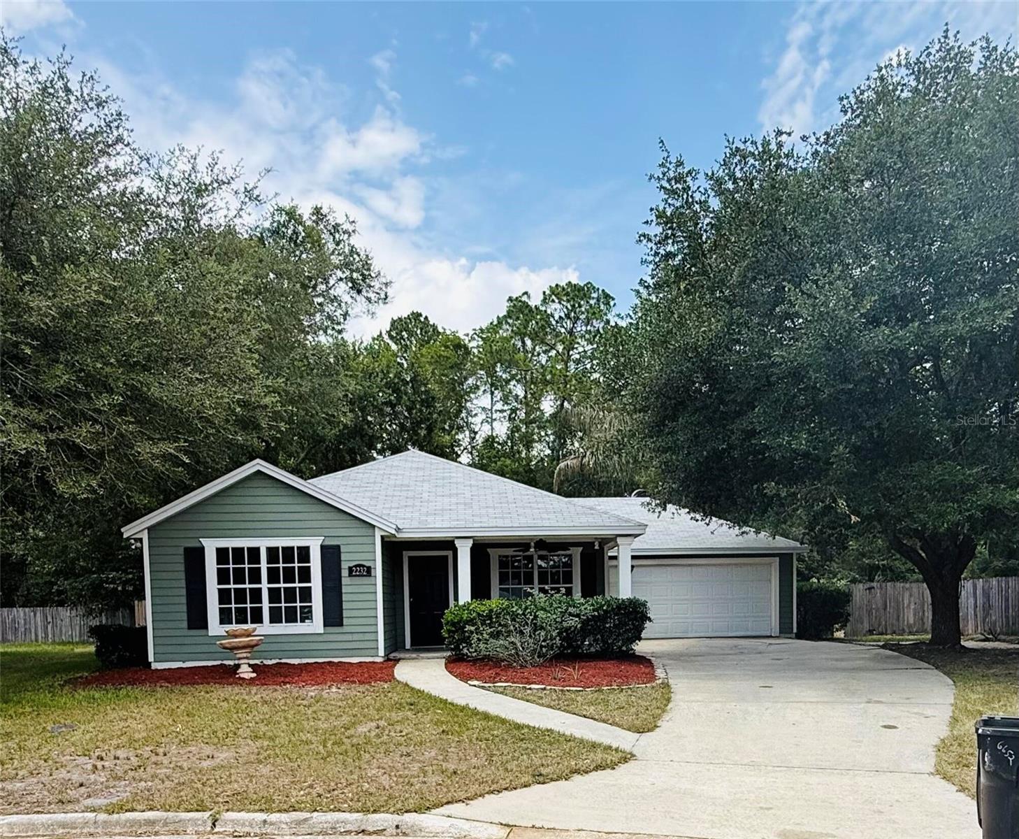 Adorable, newly renovated home (4 years ago) with open floor plan, beautiful kitchen, stainless steal appliances, tile and laminate flooring (no carpet), on a beautiful, quiet cul-de-sac. It has a 2 car attached garage, laundry room with washer and dryer hookups, beautiful front yard with mature trees and a fully fenced backyard! This neighborhood is really cute, well kept, and tucked away.  No neighbors behind the house.  Only 3.5 miles from UF, close to public transit. Your own little slice of heaven!  Backyard has concrete and pavers. Lots of space for dining, a garden, putting in a storage shed, etc.  Laundry room inside the house.
The area is gorgeous.  All homes kept up, great neighbors, even a small neighborhood park across the street!  About half way between the airport and UF, super convenient! It has a great open floor plan. And no carpet!  Vaulted ceilings make it feel light and airy.  Secondary bedrooms are big.  Walk in closets!  Mater bedroom has a large window out the front of the house with a walk in closet. 
Huge front porch, plenty of room for a few chairs and a table.