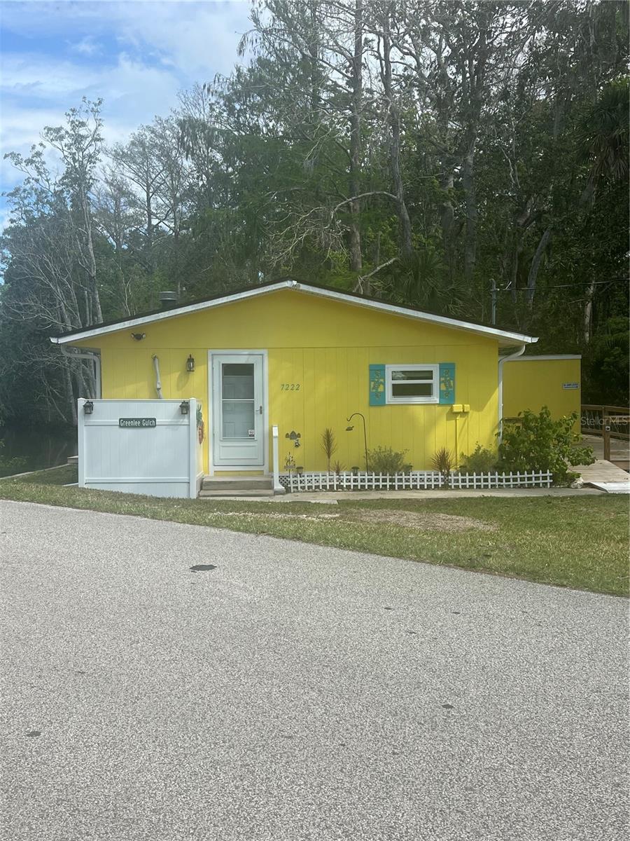 Welcome to the most beautiful piece of property with complete privacy on one side with the conservation and birds chirping and to the other side, you have a flowing river leading directly to the gulf of America, unobstructed. This property has been completely remodeled down to the door handles. Starting on the outside, the home has been painted and gutters installed with 4 down spouts. Hot water heater 2025 , Windows 2023, Electrical panel 2022,Roof 2022. The DECK is the most peaceful, and amazing addition to this home. Its handicap accessible and has plenty of space for a party! Wraps around a third of the home with a ramp in the front. Big bright windows in the living room give you an amazing view of the river which you can light up a night with the new lamp posts outside. If you get a little chilly use the WOOD burning fireplace to warm you up or hang stockings for Christmas! Brand new mini split inside with heat and AC, Tile flooring, granite countertops and light fixtures, light switches, plugs and plates. New baseboards, and paint throughout. Now lets talk about this bathroom. Each one of these special order Spanish order bathroom tiles were individually set for the mermaid shower. All new plumbing, new vanity and mirror. Right off the deck is your dock for fishing and a set of stairs leading to the river. This crystal clear water has fish, manatees, and birds. Launch your kayak off of your own dock to go explore. The upper deck restaurant is about 0.01 miles away as well as Rodgers park. You're basically in their back yard. Continue this as an AIR BNB or live in it on your own, either way this is your rare opportunity to own a piece of paradise on the Weeki Wachee River.