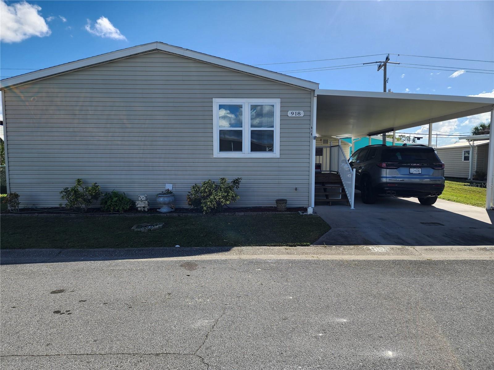 Welcome home to the most spacious manufactured home I've ever been in! Own your own home and land for a fraction of the cost of other homes. This is an active 55+ community and you do not want to miss this meticulously maintained home, built in 2010. Offering over 1200 square feet of thoughtfully designed living space, perfectly balancing split bedrooms perfect for guests. This home highlights many updates with new roof, updated laminate flooring, new double pane windows and so much more! There is lots of storage space, indoor washer and dryer with a large carport to enjoy the great outdoors. Fair Lane Acres is one of the few pet friendly, land owned communities close to area transit and 20 minutes to the beach. Close to restaurants, shopping, golf and fishing! This is the perfect home for season living or a full-time resident. With easy access to major arteries to easily stay in town or head east or west. Do not miss the opportunity to make this stunning and beautiful property your own!! This home suffered roof damage from hurricane Milton, and repairs from a qualified roofing company will make this home brand new. This home won't last and is ready for you to call home. Call today to schedule your private showing!!