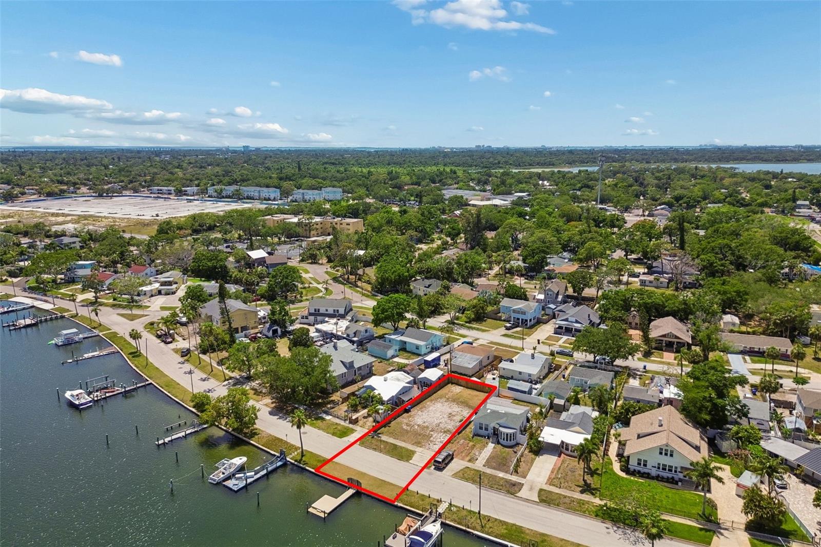 Custom Home & Spec Build Alert – rare waterfront opportunity in the heart of St. Petersburg. Welcome to 4005 Sunrise Dr S, a 47x101 waterfront lot tucked away on one of the city’s most peaceful and sought-after streets. This is the first vacant lot to become available on this stretch in over 50 years — a truly rare chance to secure premium waterfront land in an area where inventory is nearly nonexistent. Positioned in a quiet no-wake zone, the property offers calm, protected water with quick access to Tampa Bay, creating the ideal setting for a future luxury waterfront residence. A private dock is already in place, adding immediate value while saving both time and expense for the next owner or builder. Existing architectural plans may also be available from the seller, helping fast-track the path from purchase to construction. Surrounded by luxury homes and strong resale demand, this homesite is perfectly suited for a custom waterfront build. The location combines privacy with convenience — less than 3 miles to vibrant downtown St. Pete and walkable to local restaurants, coffee shops, and waterfront parks featuring pickleball, tennis courts, basketball courts, dog parks, and scenic green space. Enjoy evening bayou walks, easy boating access, and quick trips to the Gulf beaches while living in one of St. Pete’s fastest-growing luxury waterfront pockets. Build new. Build luxury. Build where opportunities like this almost never exist.