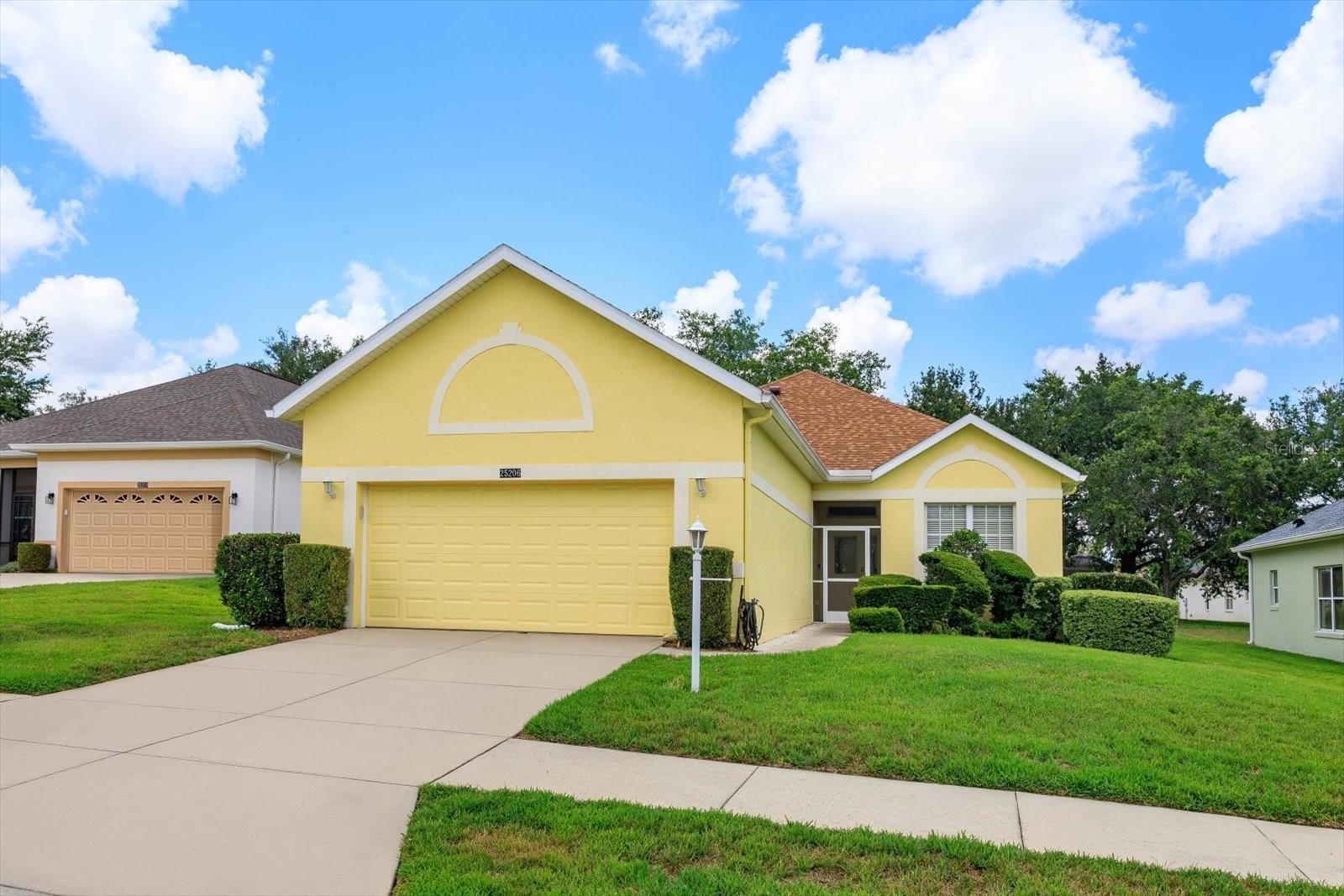 Calling all Golfers! Live Your Best Life in this beautifully renovated, move-in-ready home located within a guard-gated, golf cart-friendly resort community offering incredibly low HOA dues packed with exceptional amenities and championship golf. Perfectly positioned on a quiet cul-de-sac homesite with mature lush landscaping and beautiful shade trees, this completely updated residence combines comfort, style, and easy Florida living. Featuring a NEW Roof (2023), this light-filled home showcases all new flooring throughout, including luxury laminate flooring in the main living areas, updated granite countertops, solid wood kitchen cabinetry, and a full suite of newer appliances including range, dishwasher, microwave, refrigerator, washer, and dryer. The semi-open floor plan is ideal for entertaining and everyday living, while the spacious Florida Room provides additional year-round living space perfect for relaxing or hosting guests. Additional upgrades include recently painted interior spaces, updated lighting fixtures and ceiling fans throughout, plumbing improvements, and inviting comfortable living areas filled with natural light. The spacious Primary Suite features a large walk-in closet, and the flexible 3-bedroom layout offers space for guests, hobbies, or a home office. Enjoy maintenance-free convenience with landscaping included in HOA dues, giving you more time to enjoy the incredible lifestyle this community offers. Community amenities include:• Guard-gated entrance and beautifully maintained grounds• Championship golf courses• Resort-style swimming pools• Clubhouse with social events and activities• On-site restaurant and dining• Tennis courts• Golf cart-friendly • Endless clubs, activities, and active lifestyle opportunities• Friendly, welcoming atmosphere• Convenient access to shopping, dining, medical facilities, and Central Florida attractions. This is more than just a home, it’s the lifestyle upgrade you’ve been waiting for!