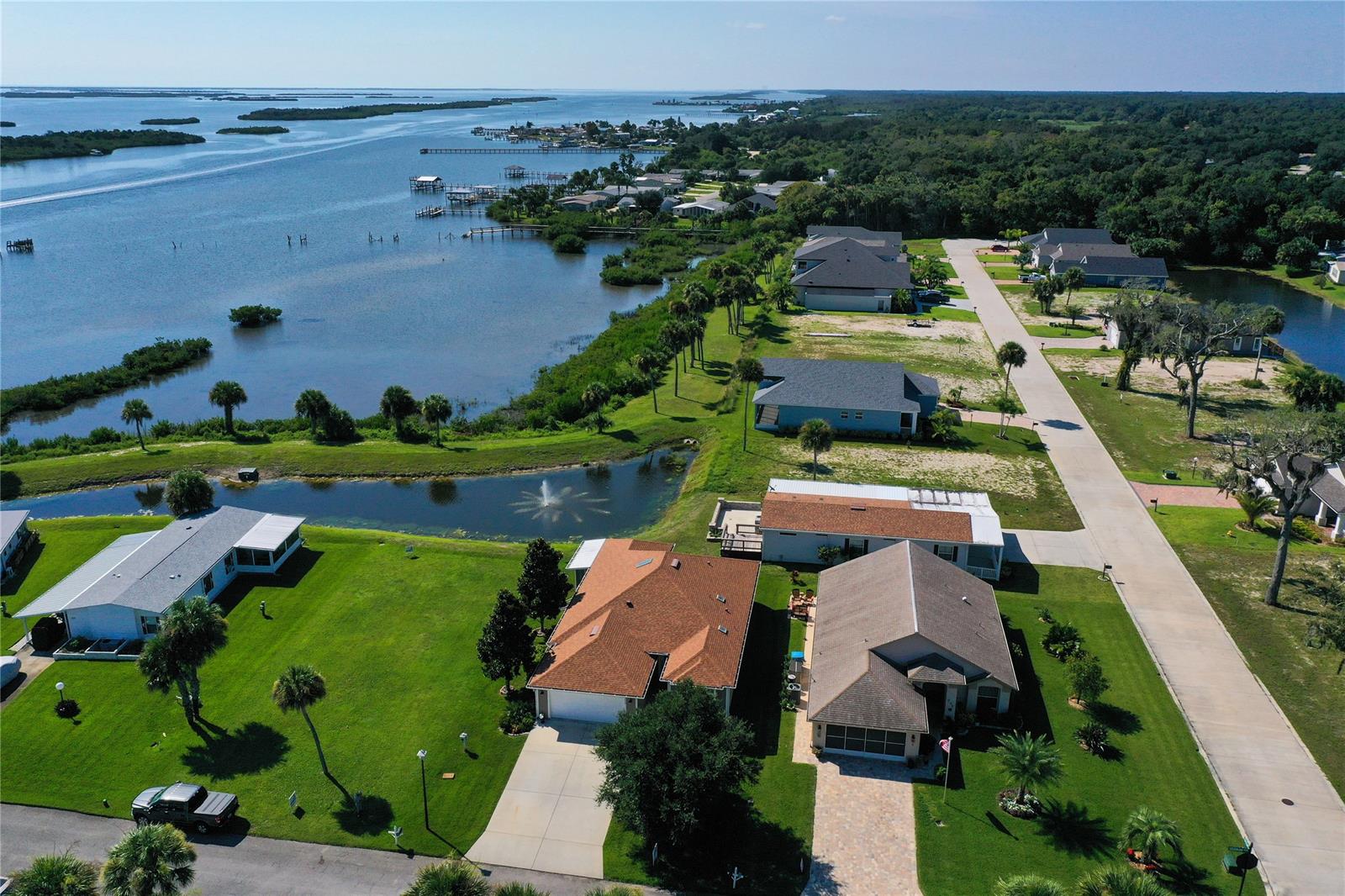 72 HOUR KICKOUT DUE TO HOME SALE.
Live at the edge of the intracoastal waterway. Pride of ownership shows in this immaculate home with skylights in the vaulted ceiling, open floor plan and 21x15 screened waterfront patio. This home features granite countertops, wood cabinets, tile flooring, insulated windows and storm panels, private community boat ramp. Convenient to shopping, dining, interstate access and the beach! Will combine with 243 Golden Bay, vacant lot to the east for $604,900. Easy to view with short notice! ;Water: City