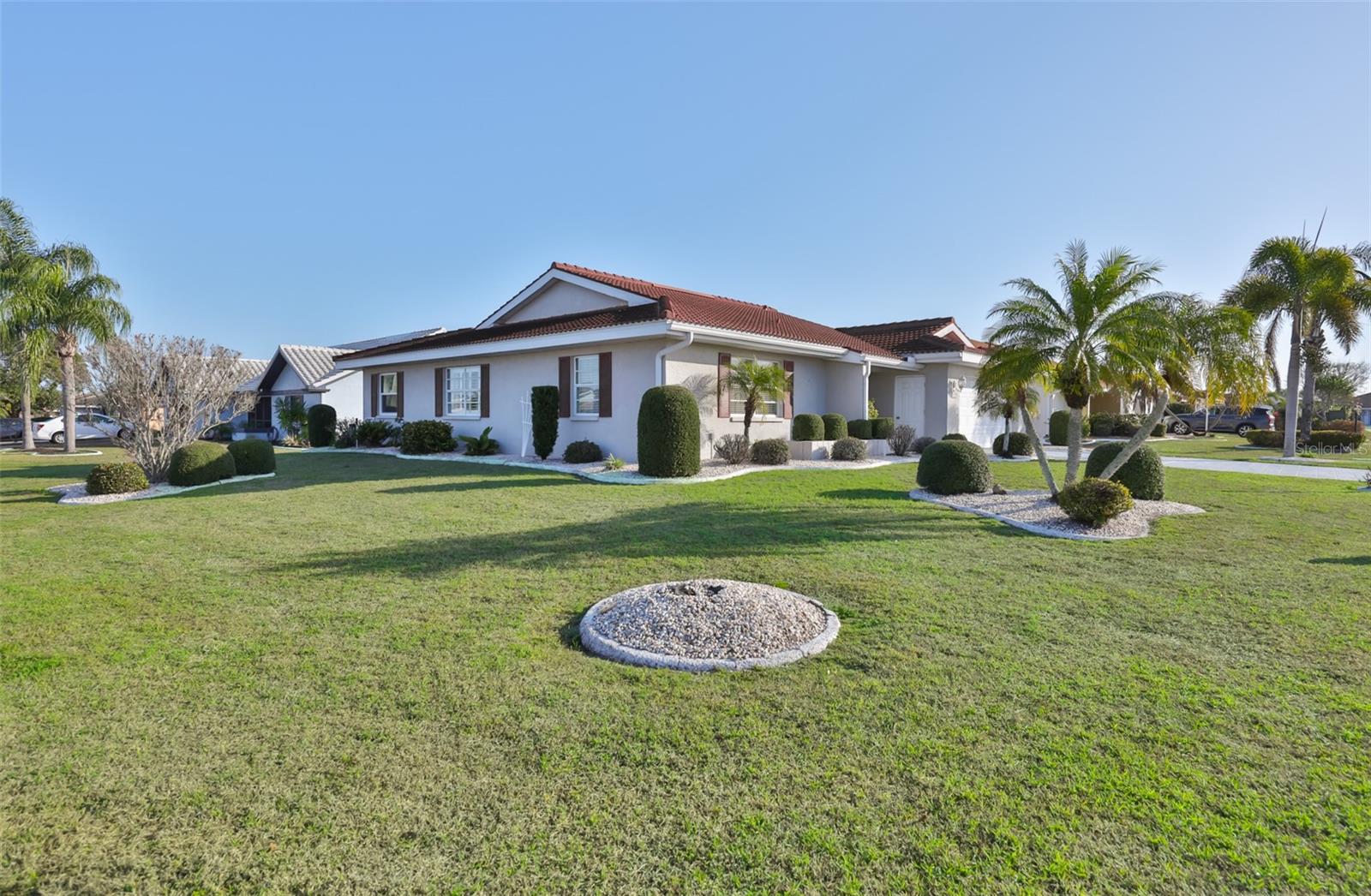 Click On 3D Interactive Tour Above ----- BEAUTIFULLY UPDATED HOME IN A DESIRABLE, LOW HOA NEIGHBORHOOD!  Welcome to this immaculate & perfectly maintained home nestled on a large corner lot in the highly sought after area of Greenbriar in Sun City Center, FL.  This lovely 2 bedroom/2 baths & den home boasts almost 1900 square feet of light & bright modern open living space.  The attractive curb appeal is enhanced with lush landscaping, PAINTED DRIVEWAY (2025), and beautiful TILE ROOF (2016 W/15 YEAR WARRANTY).  Enter through the inviting foyer and fall in love with the spacious & functional floorplan that is filled with tons of natural light.  The comfortable living room/dining room combo is perfect for entertaining or simply lounging.  The gorgeous eat-in kitchen has plenty of "shaker" style white cabinetry, tons of counter space, newer stainless appliances (2025) and large dinette area.  The private owner's suite has ample space for a king size bed, has a walk-in closet and nice ensuite bathroom w/walk-in shower.  The large 2nd bedroom and full bathroom are at the opposite end of the home providing total privacy for your guests.  As an extra bonus, the amazing 24 x 9 den/study is a versatile space at the rear of the home that has endless possibilities.  When you want to relax, retreat to the lanai area (RE-SCREENED 2022) where you can enjoy the Florida sunshine.  Further updates are:  HVAC (2019 & MAINTAINED TWICE/YR), WASHER & DRYER (2021), ELECTRIC PANEL (2021) and 4 IMPACT WINDOWS AT REAR OF HOME (2025).  This home is just a short golf cart ride to all Sun City Center amenities such as shopping, restaurants, banking, doctors, various volunteer opportunities, numerous social and sporting clubs, and so much more.  Sun City Center is conveniently located to major highways, airports, Tampa, Sarasota, award winning beaches, and of course Disney.  So come and view this beauty today and see why you'll want to call it home!
