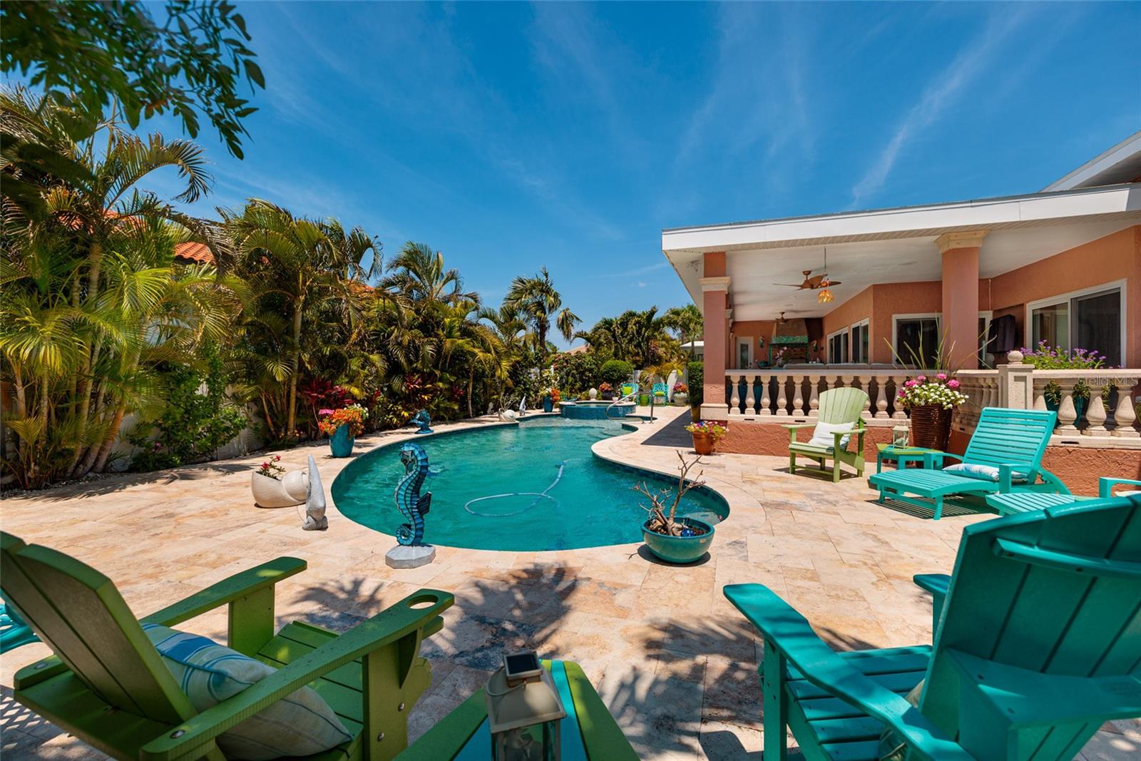 Enjoy true island living from your own private oasis! This beautifully updated 4-bedroom, 3-bath home has been meticulously maintained and is move-in ready. The open-concept design is showcased by a stunning oversized island that seamlessly connects the kitchen, dining, and family room—perfect for entertaining and everyday living. The split-bedroom floor plan offers privacy and comfort, ensuring space for both family and guests. Inside, the spacious great room keeps everyone connected, whether you're preparing meals in the modern kitchen or unwinding with family and friends. This home blends luxury, functionality, and laid-back island charm. A large 3+ car garage provides incredible flexibility for vehicles, golf carts, or even a workshop. Step outside to your resort-style outdoor kitchen and covered porch, where you can relax in the shade while overlooking the fully updated pool, an ideal setting for enjoying Florida living year-round—don’t miss the opportunity to make it yours!.