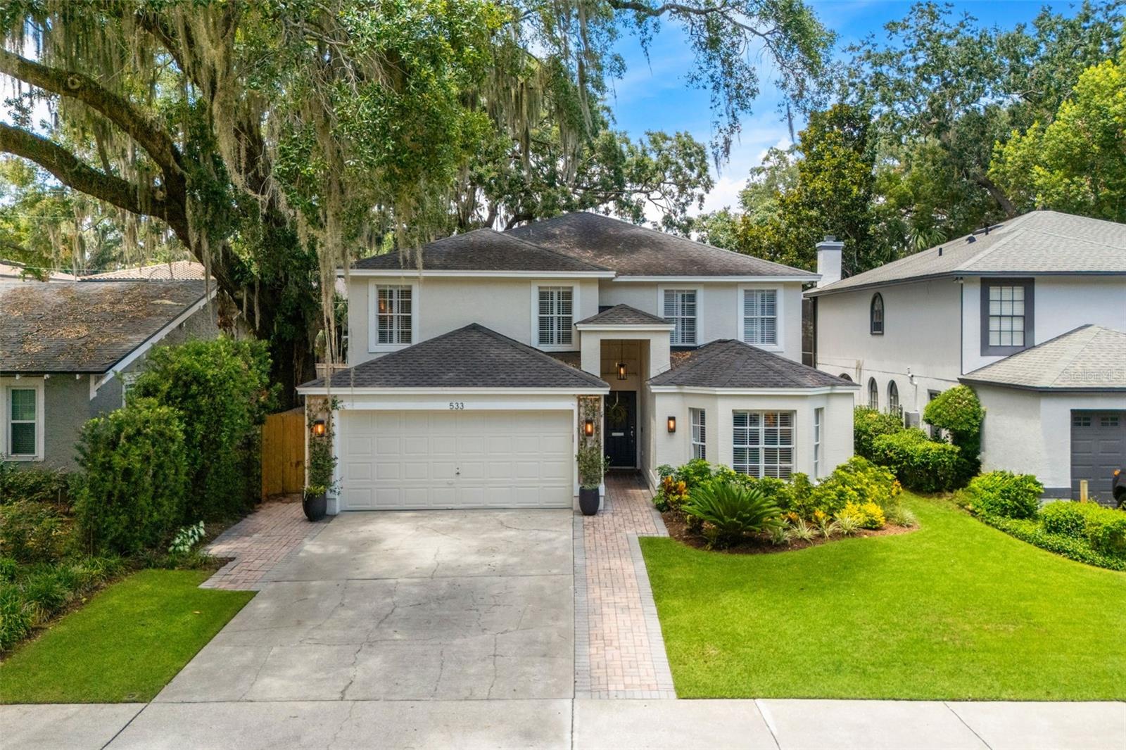 College Park charm, wrapped in personality, style, and the kind of everyday convenience people move here hoping to find. Just four doors from Starbucks and Publix, this 5 bedroom, 3 bathroom home offers approximately 3,000 square feet of inviting living space in one of Orlando’s most established and sought-after neighborhoods.

From the moment you step inside, the home feels layered, collected, and full of life. Arched windows, plantation shutters, engineered hardwood floors, a wood burning fireplace, designer wallpaper, warm brass accents, and thoughtfully chosen finishes give each space a sense of character you simply cannot mass produce. The living spaces feel both polished and personal, with room to gather, linger, host dinner, curl up by the fire, or settle into the rhythm of College Park living.

The kitchen is bright, functional, and beautifully updated with quartz countertops, white cabinetry, stainless appliances, subway tile, generous storage, and a large island that anchors the heart of the home. Just beyond it, the breakfast nook feels like the kind of sunny corner where coffee runs long and weekends start slowly. The dining room brings the drama in the best way, with Rifle Paper wallpaper, open shelving, and a transportive, dinner-party-ready feel.

With five bedrooms and three bathrooms, the floor plan offers flexibility for guests, work-from-home space, playrooms, hobbies, or multigenerational living. The downstairs bath was remodeled with Serena & Lily wallpaper and warm modern finishes, adding another layer of style and charm.

Out back, the large yard and covered patio create a true extension of the home, with space for grilling, entertaining, gardening, pets, play, or quiet evenings outside. A natural gas hookup is available for the patio grill.

As someone who has lived in College Park for over a decade, including right across the street, I can tell you there is something truly special about this pocket of the neighborhood. Located within the Lake Ivanhoe District area of College Park, this home offers that rare blend of walkability, established charm, and everyday convenience, just minutes from Lake Ivanhoe, Edgewater Drive, Downtown Orlando, AdventHealth, Lake Highland Prep, and Bishop Moore.

College Park is ideal for buyers who want charm, walkability, local restaurants, coffee shops, parks, everyday convenience, and a true neighborhood feel close to the center of Orlando. It is a neighborhood for people who want more than a house. They want a lifestyle, a routine, a favorite coffee spot, and a place that feels connected.

Currently zoned for Princeton Elementary School, this home offers the rare College Park combination of space, updates, personality, a generous backyard, and an incredibly convenient location.