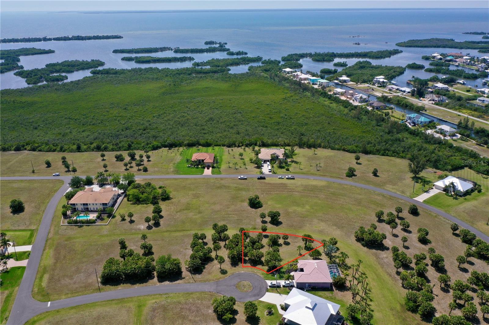 This premier homesite is nestled at the end of a quiet cul-de-sac in the highly regarded deed-restricted community of Burnt Store Lakes. This oversized property is 11,507 sqf (0.26 acres) with 44 feet of road frontage and features a tranquil greenbelt area directly behind the lot, providing an extra buffer of privacy and a lush natural backdrop for your future home. The generous size of this lot ensures it is big enough to accommodate a spacious floor plan along with a nice outdoor pool and patio area, perfect for enjoying the year-round Florida sunshine. Building here is simplified and stress-free, as the property offers access to public water, sewer, and electric, and it comes with the invaluable peace of mind that there are no scrub jay issues and no wetlands to navigate during the construction process.

The community of Burnt Store Lakes is known for its meticulously maintained homes and quiet atmosphere, situated immediately adjacent to the world-class Burnt Store Marina. Residents enjoy close proximity to the marina’s deep-water slips, dry storage, and waterfront dining, while still maintaining the serenity of a residential enclave. For those who travel or commute, the property is conveniently located roughly 15 minutes from I-75, offering effortless access North and South to entire state. Find yourself perfectly positioned between the historic charm of downtown Punta Gorda and the vibrant amenities of Cape Coral and North Fort Myers.

Outdoor enthusiasts will find no shortage of recreation, as Southwest Florida boasts one of the highest concentrations of golf courses in the world and the local area is teeming with parks and scenic nature trails. Just down Burnt Store Road, you can explore the Alligator Creek Preserve at the Charlotte Harbor Environmental Center, which offers miles of interpreted nature trails through beautiful pine flatwoods and freshwater marshes. The region is a mecca for world-class fishing, with easy access to the pristine waters of Charlotte Harbor and the legendary tarpon fishing of Boca Grande. When you are ready for a beach day, you are perfectly situated to explore the coast; the sparkling sands of Boca Grande and Englewood beaches are approximately 35 miles away, while the lively atmosphere of Fort Myers Beach and the world-renowned shelling of Sanibel Island are within a comfortable driving distance. This is a rare opportunity to build on this cul-de-sac lot, in a community that offers the perfect balance of natural beauty and modern convenience.