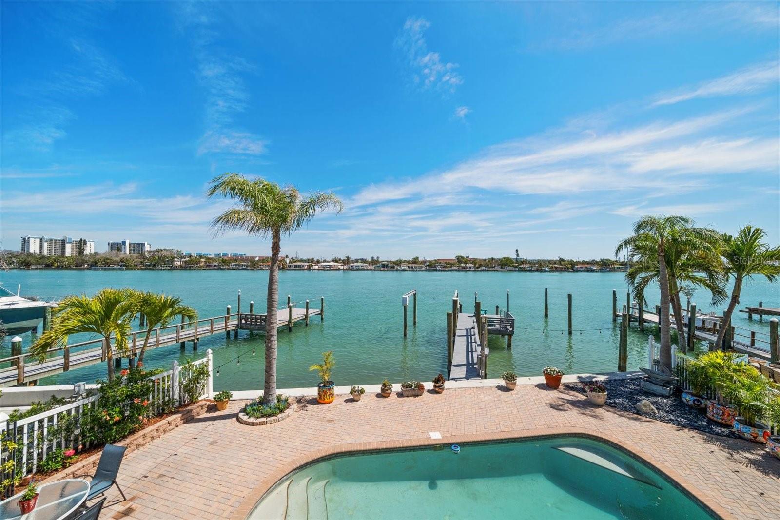 Immerse yourself in the Florida lifestyle in this Sunset Beach Waterfront Oasis with captivating water views. Included in a collection of only 5 homes that are situated on premier Sunset Beach lots, picturesque from the moment you arrive. Elevated pool home blends luxury living in a vibrant beach community. A chef’s kitchen connects to the open indoor & outdoor living areas offering the perfect venue for entertaining. Picture windows, French Doors & balconies offer sweeping views throughout. The entire top floor is reserved for the owners. Step into luxury and Unwind in the waterfront soaking tub in a spa inspired bathroom. Leave reality behind and disappear into your waterfront back yard playground, teeming with marine life and active & passive boat recreation. Exceptional opportunity to own one of the premier Sunset Beach locations. Let the photos guide you to discover your next Chapter & Unlock your new lifestyle.