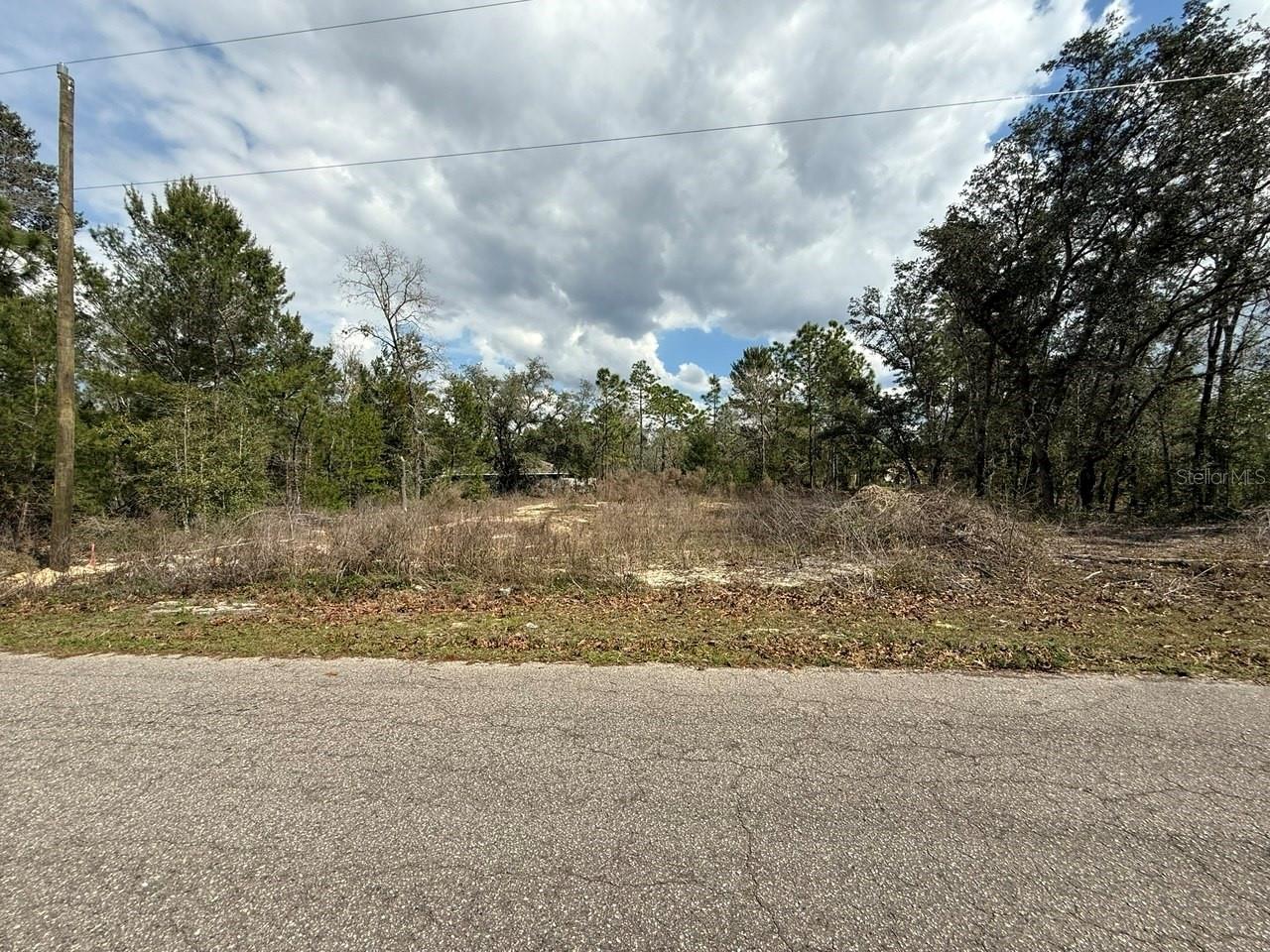 0.23 acres cleared lot located in Ocklawaha, Florida. A current survey is available, and the environmental review indicates no wetlands on the property. The lot has previously received approval to build a single-family residence, 3 Bedroom / 2 Bathroom of approximately 1,371 square feet, and architectural plans from the prior approval are available upon request. Ideal for buyers seeking a recreational or residential opportunity with access to boating, fishing, and kayaking. Ocklawaha is a hidden gem in Florida, surrounded by beautiful nature and friendly communities. It’s a place where you can escape the hustle and bustle of city life and connect with nature. Whether you're looking for a weekend getaway or a permanent home, this land is the perfect choice! Don’t wait too long! Opportunities like this don’t come around every day. Own a piece of paradise in Ocklawaha and create memories that will last a lifetime. Learn more about this incredible property! This property is part of a 7-parcel portfolio. Contact us to get more information on combo pricing.  Buyer and Buyer’s Agent to independently verify all information deemed material, including zoning, building requirements, utilities, setbacks, and development feasibility.