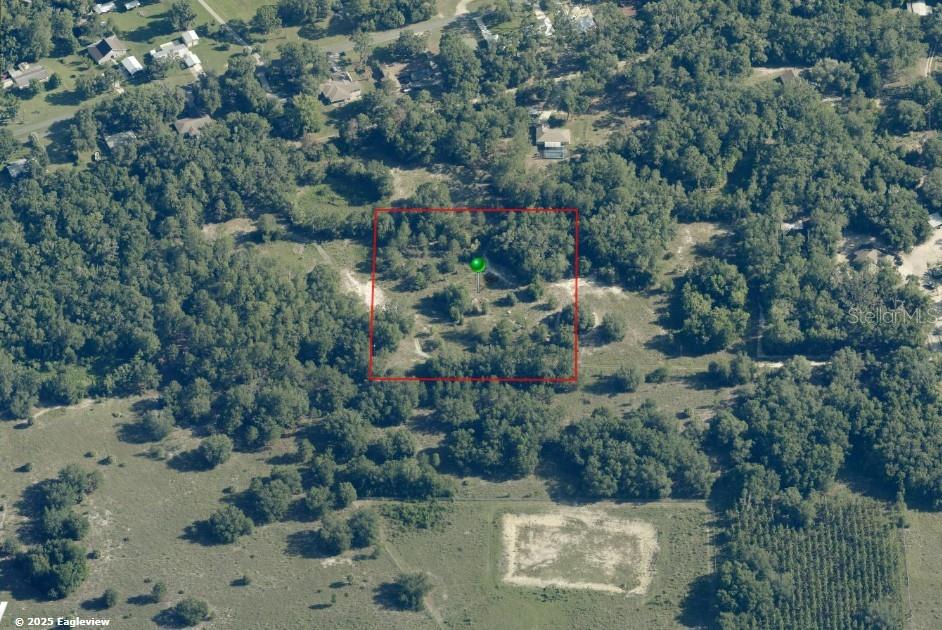 Discover the perfect blend of privacy, nature, and convenience with this 3.79-acre homesite nestled just minutes from the heart of Dunnellon! Tucked away in a peaceful setting, this beautiful parcel offers plenty of room to build your dream home while enjoying the seclusion of country living. Located less than 2 miles from historic downtown Dunnellon and less than 2 miles from public boat ramps providing access to both the Withlacoochee River and the Rainbow River, outdoor enthusiasts will love the endless opportunities for boating, kayaking, swimming, fishing, and exploring Florida's natural beauty. The property is situated in Flood Zone X, providing added peace of mind for your future homesite. A well is on the property, electric service is available with a utility pole close by, and the western property line is fenced, adding to the property's appeal and value. Enjoy quick access to shopping, waterfront dining, local parks, and Dunnellon's charming historic district while still coming home to your own private retreat surrounded by nature. Whether you're ready to build now or invest for the future, this exceptional property offers location, privacy, and recreation in one outstanding package. Priced to sell—don't miss this opportunity!