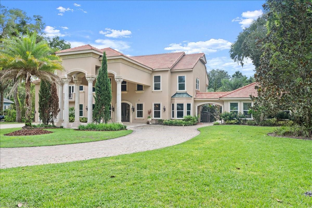 SELLER FINANCING, NO CREDIT CHECK. Experience unmatched luxury in this stunning Mediterranean Tomoka Riverfront estate. Set on 2.39 acres of natural beauty, this exquisite property was expanded and recreated in 2007 to feature a masterfully configured main house that leads to two charming guest quarters, beautifully landscaped patios, all offering breathtaking views of the serene surroundings. The captivating custom-designed interiors truly showcase every space with artisan touches and finishes that transcend time and trends. The gourmet kitchen is a culinary connoisseur's delight that is masterfully designed with elegant finishes, perfect for hosting memorable gatherings. Upstairs, discover four spacious en suite bedrooms, each boasting generous walk-in closets and private balconies that provide tranquil views and moments of peace.

Travertine porches, patios and walkways flow seamlessly from the home to the sparkling pool area, where Italian marble columns and lion fountains offer sophistication that is seldom seen.Room sizes are approximate; all information intended to be accurate but cannot be guaranteed.